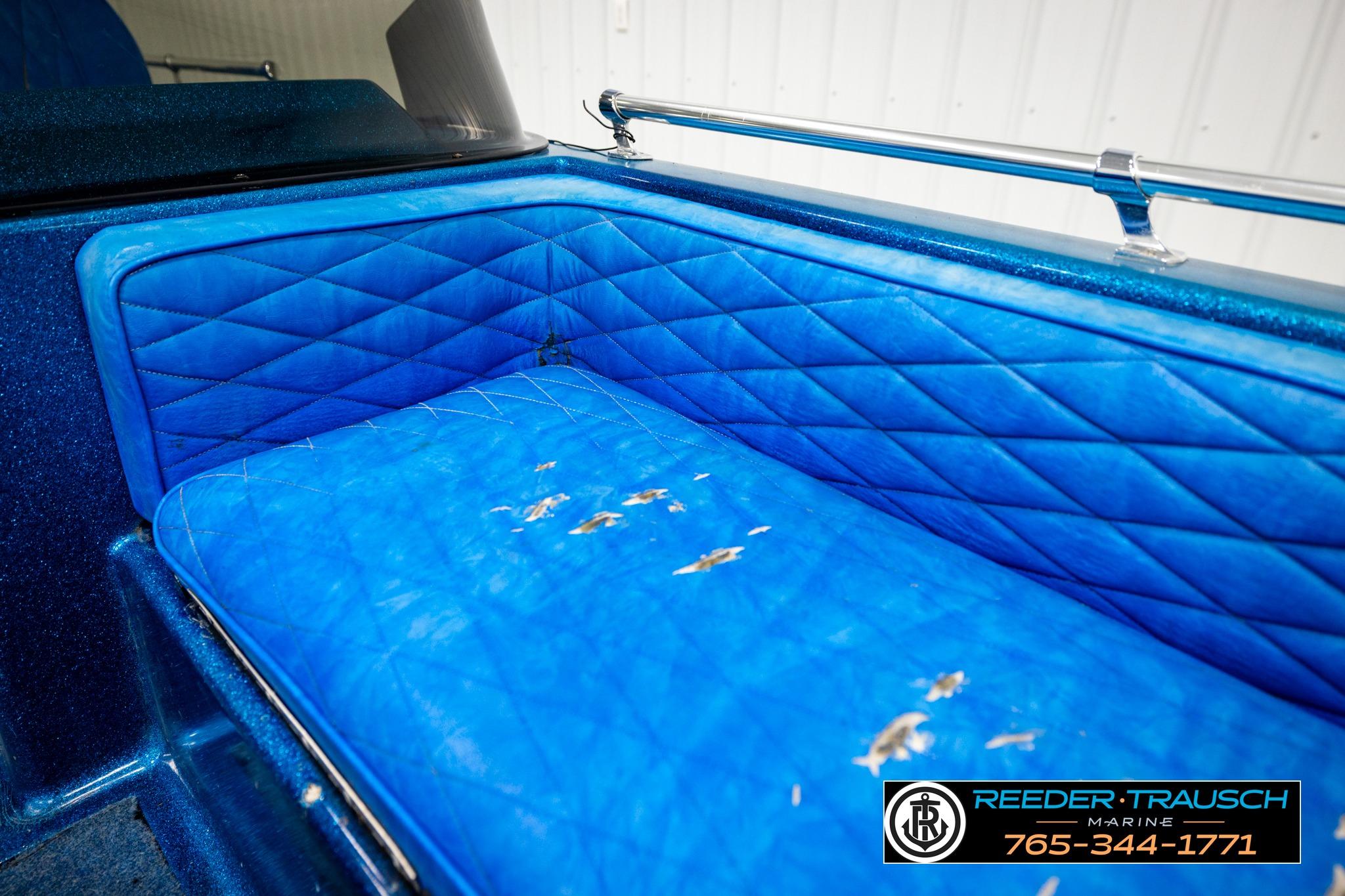 Blue quilted seat in a 1980 Ranger 175 VS boat, showing wear and tear.