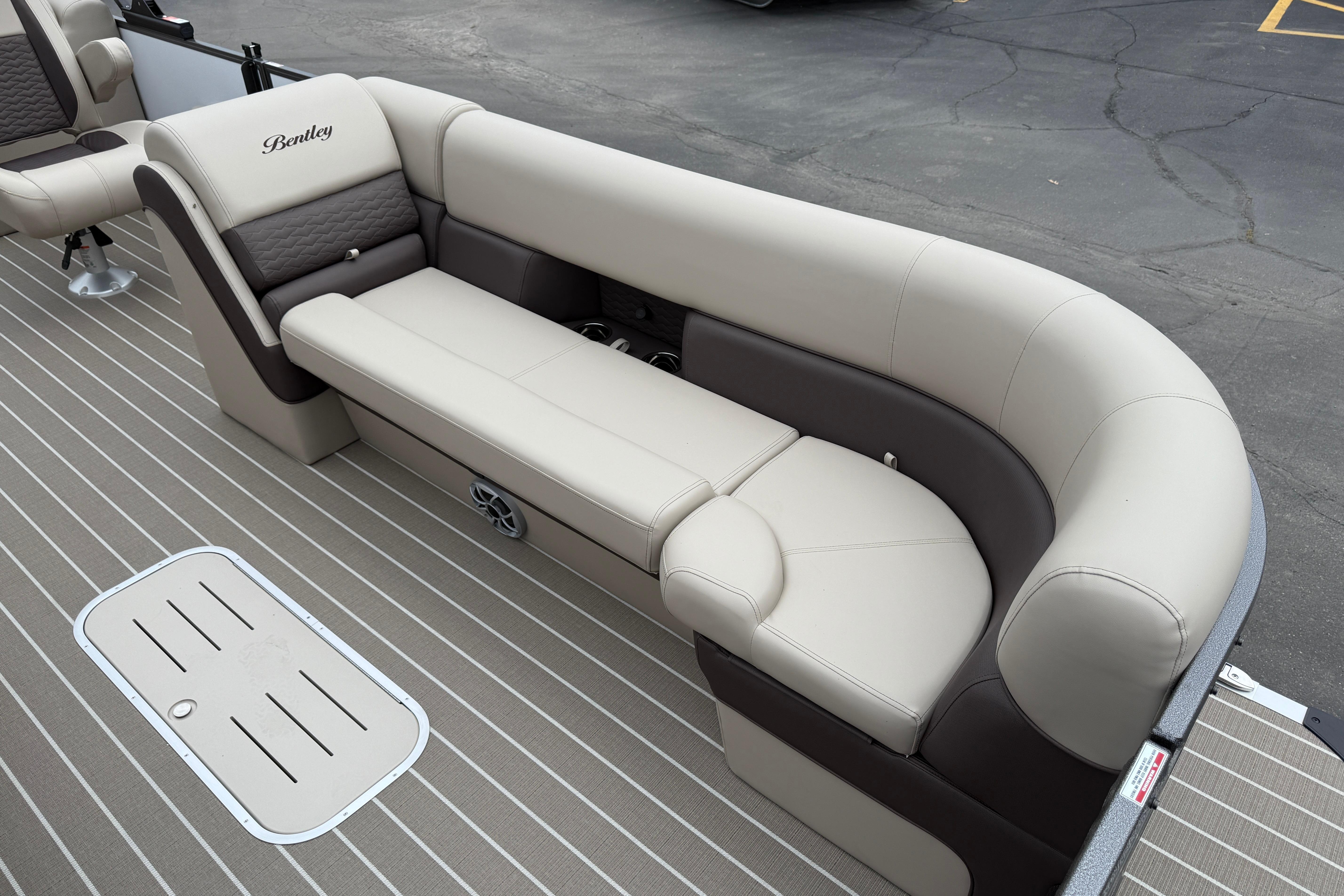 2026 Bentley Pontoons Elite 253 Admiral, luxurious seating on a pontoon boat deck.