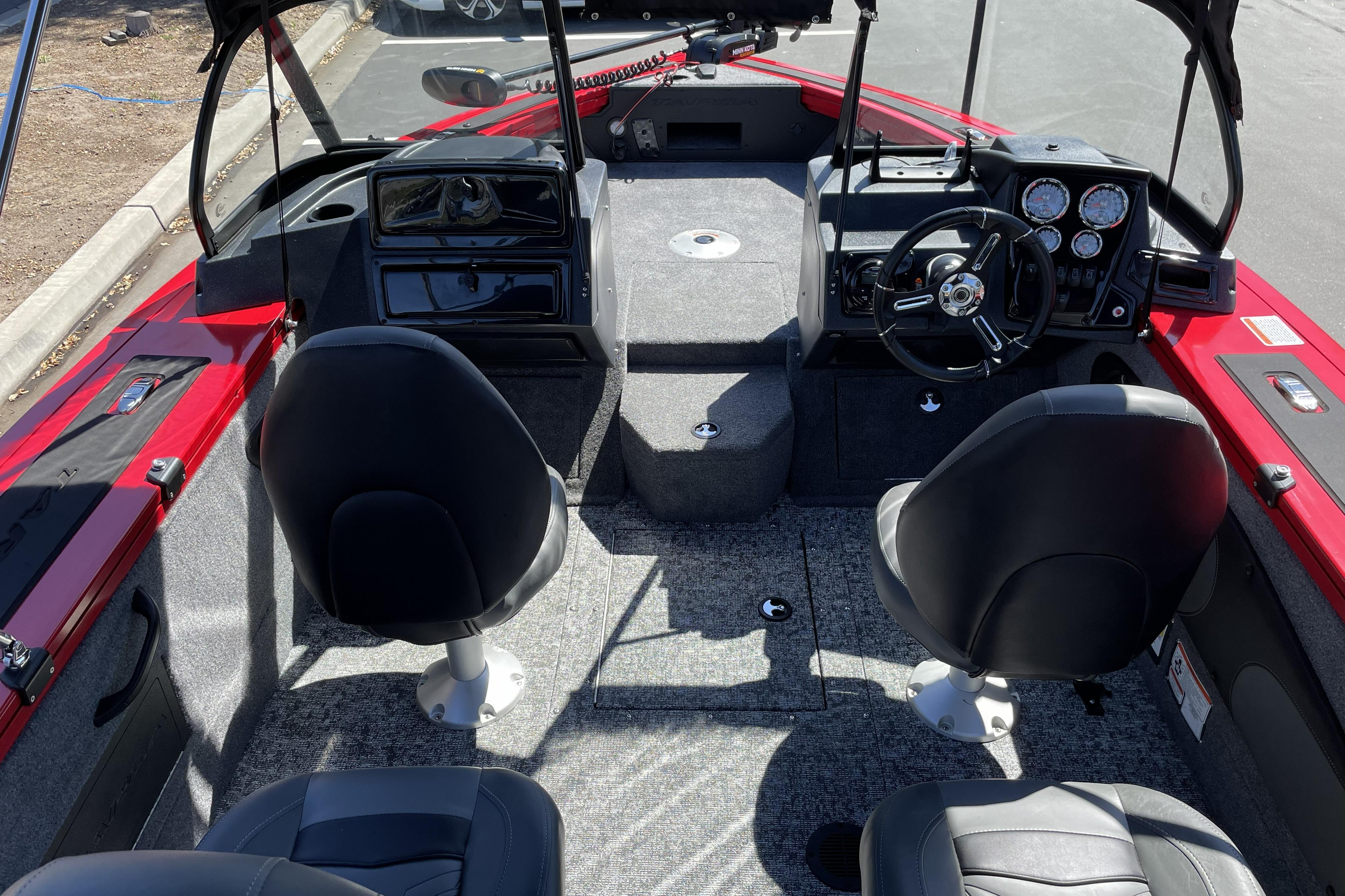 Interior of 2026 Tracker Targa V-18 WT boat with steering wheel and seating.