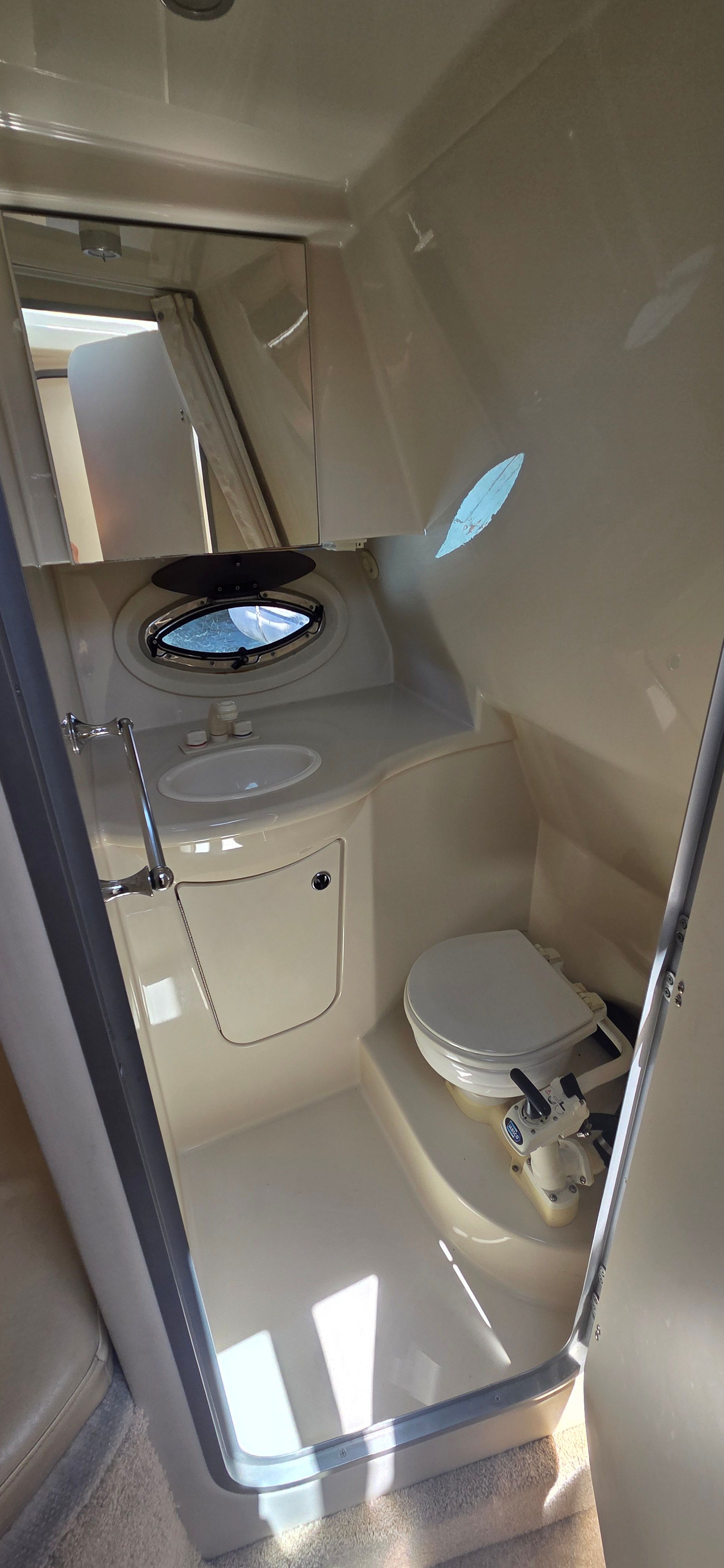 Interior of 2012 Bayliner 335 Cruiser with toilet and sink.