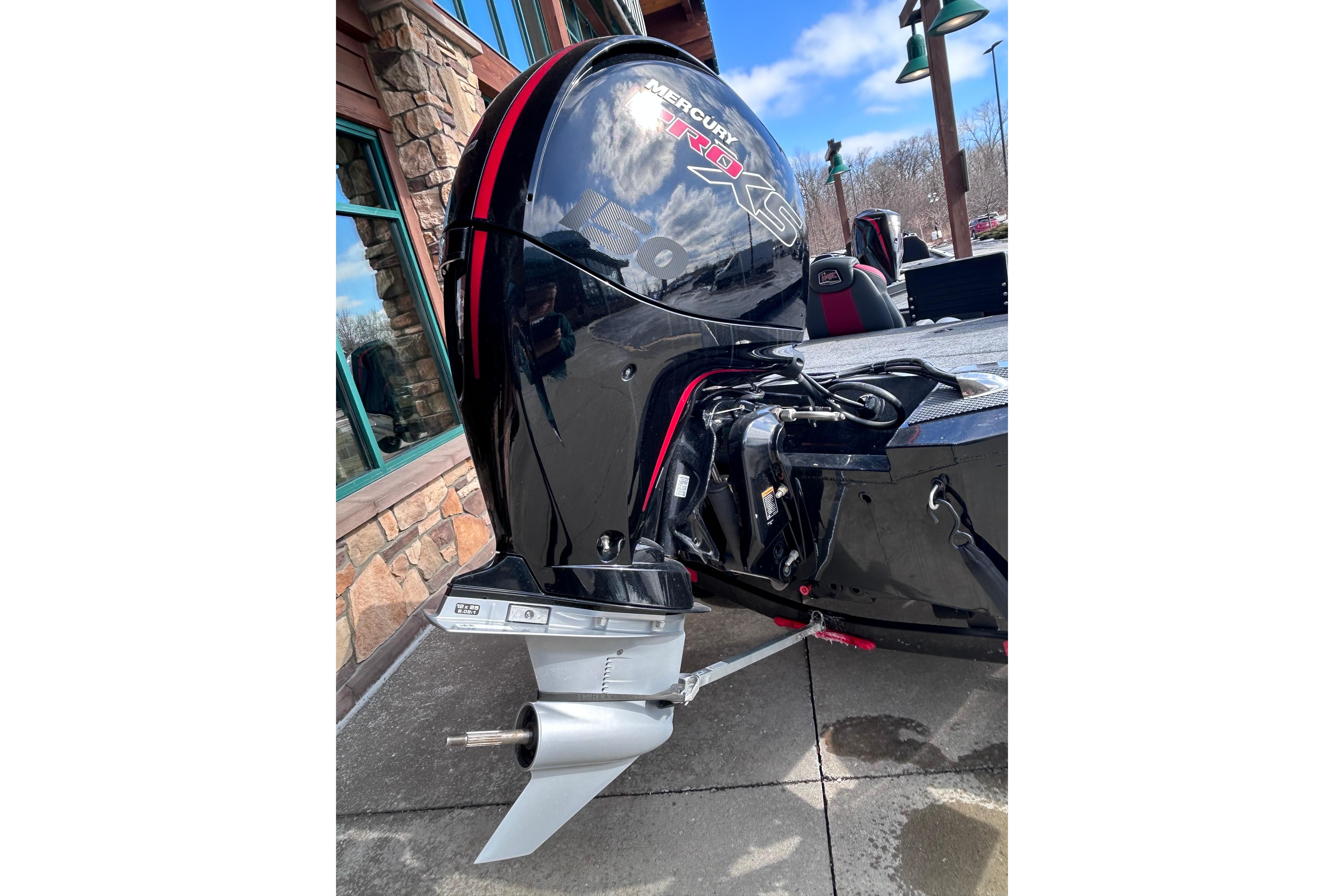 2025 Ranger RT198P boat with Mercury Pro XS outboard motor, parked outdoors.