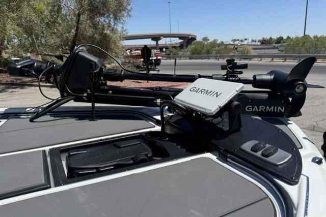 2026 Nitro Z19 XL Pro boat with Garmin equipment on deck, parked near highway.