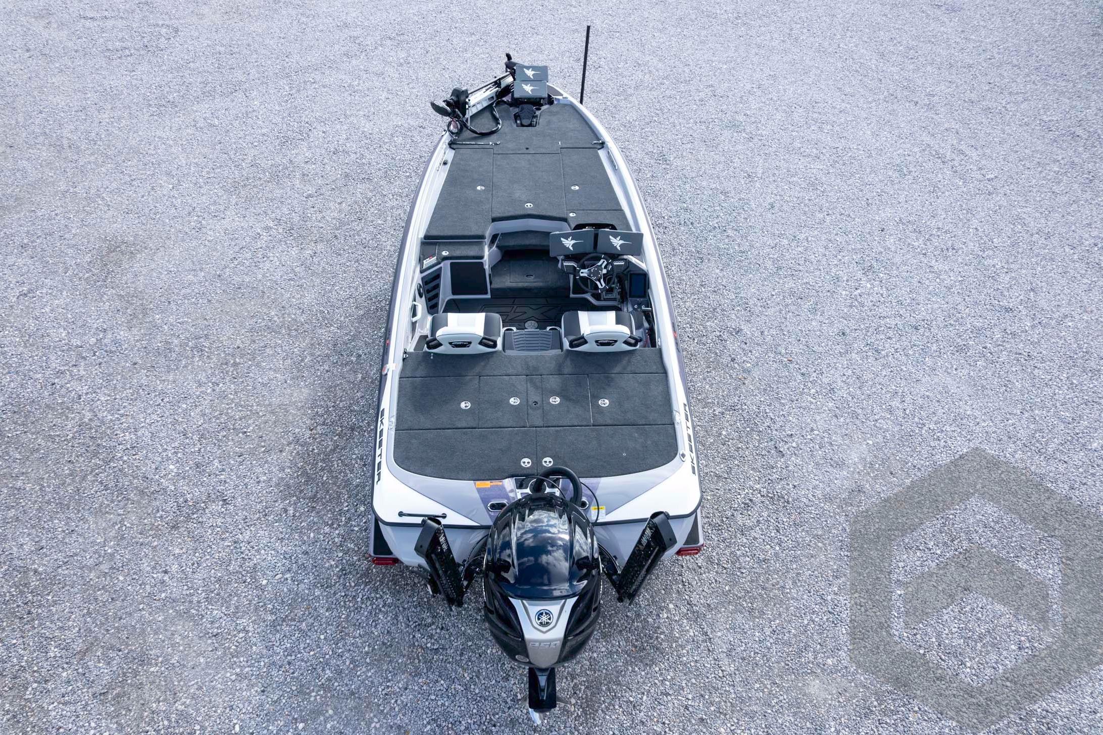 2026 Skeeter FXR20 FLEX boat, top view on gravel surface, showcasing spacious deck and seating.