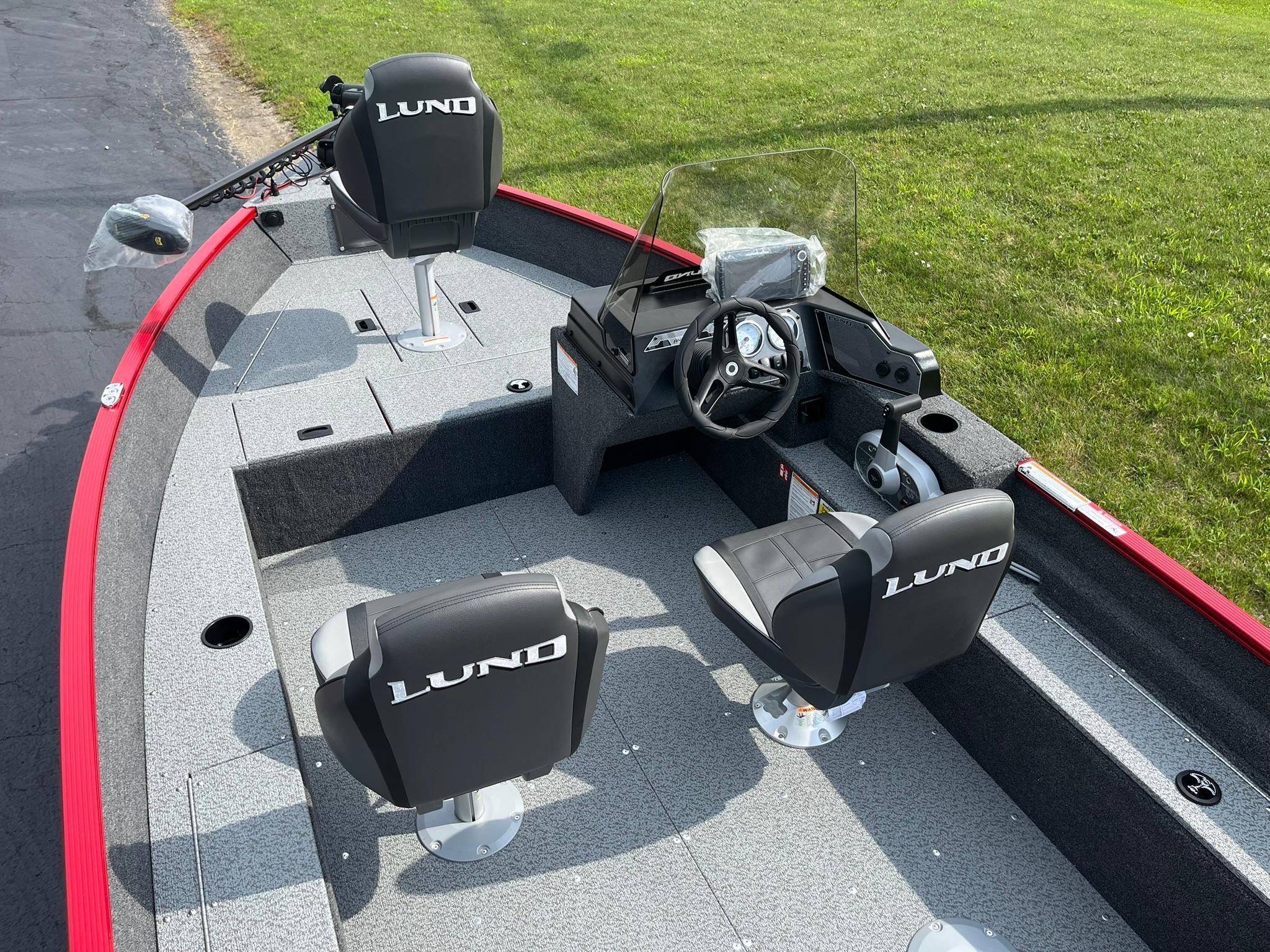 2026 Lund 1650 Angler SS boat interior with steering console and seating.