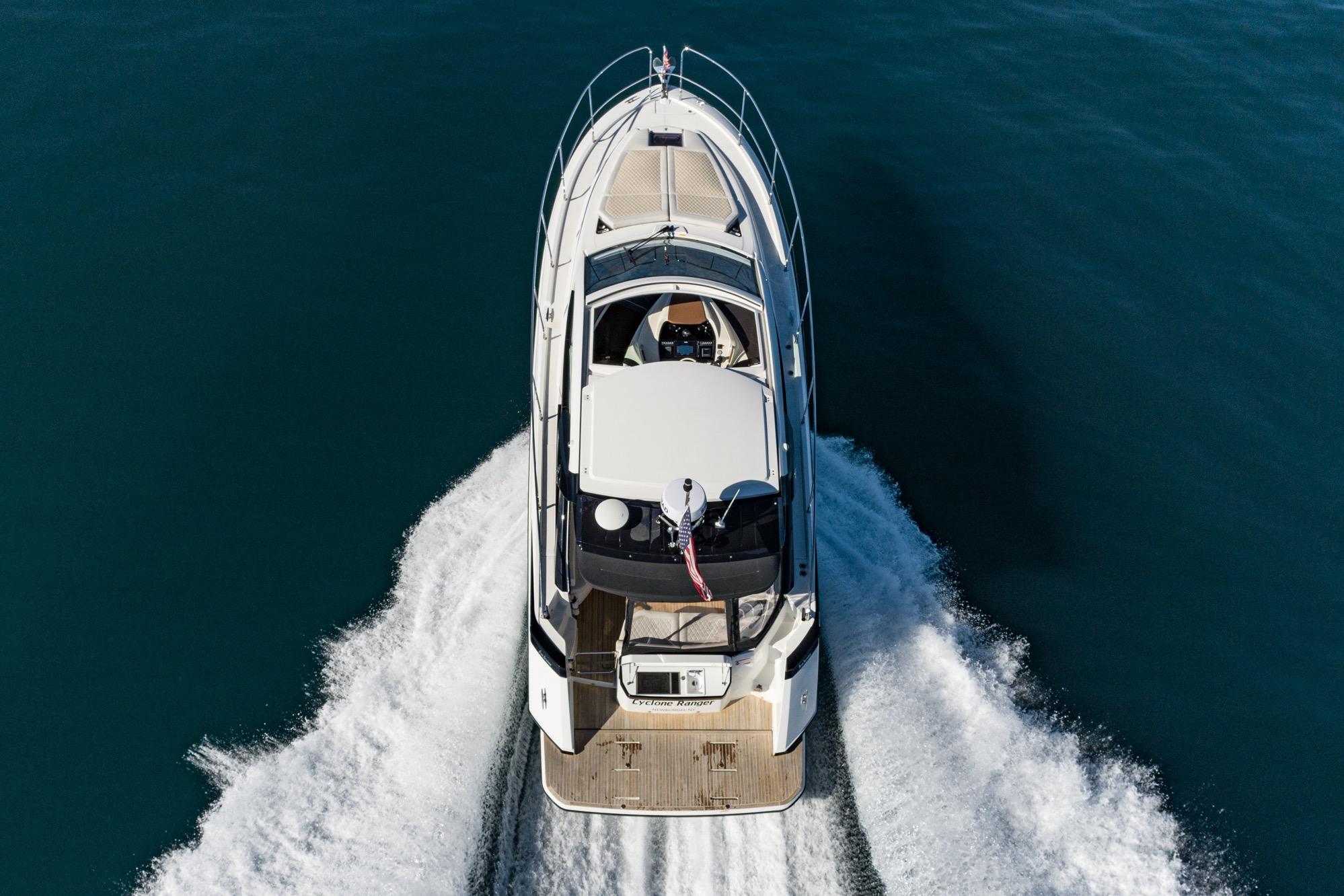 2018 Beneteau Gran Turismo 40 cruising on open water, aerial view.