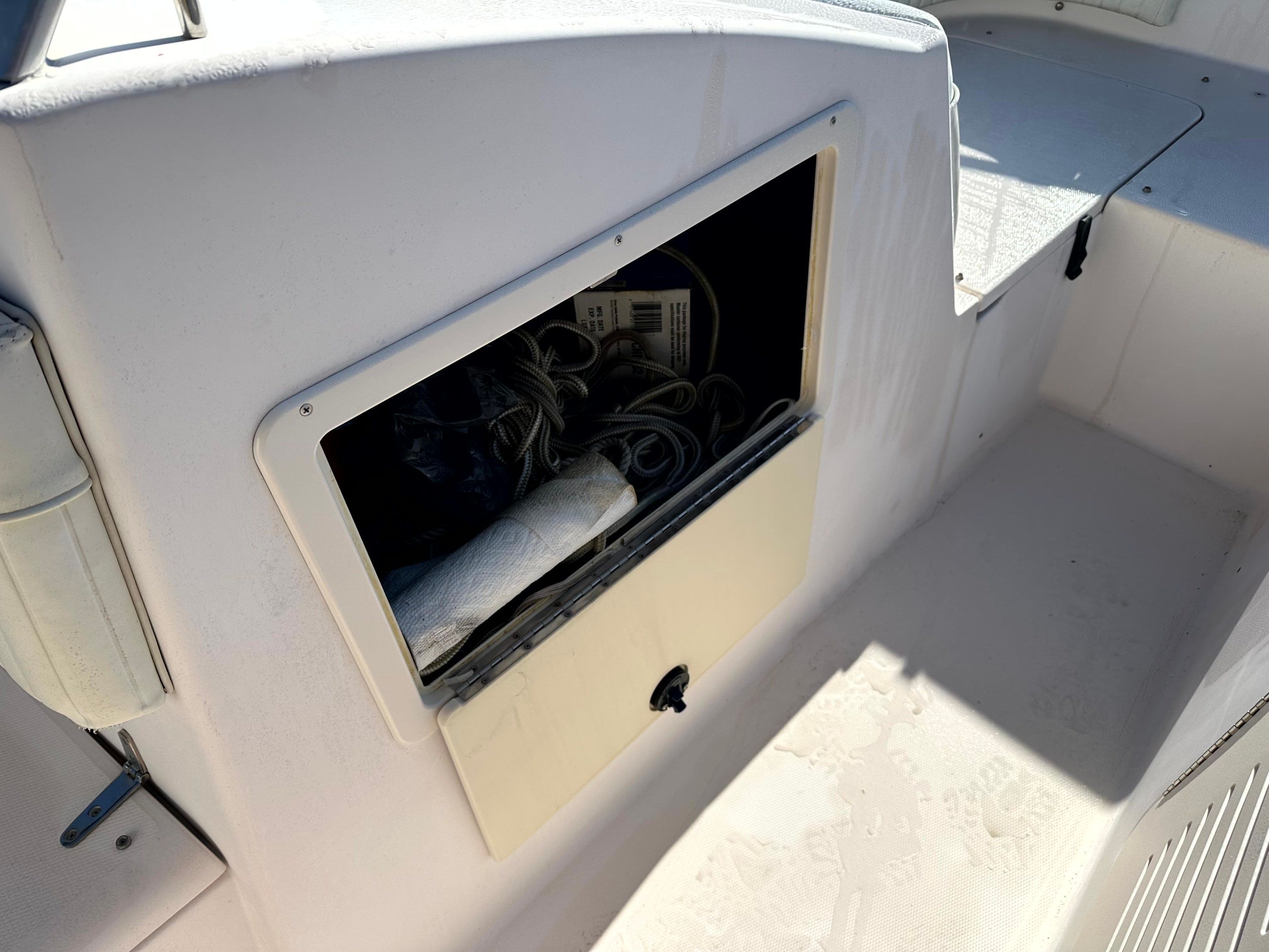 Storage compartment on 2000 Grady-White X26 Tigercat boat.