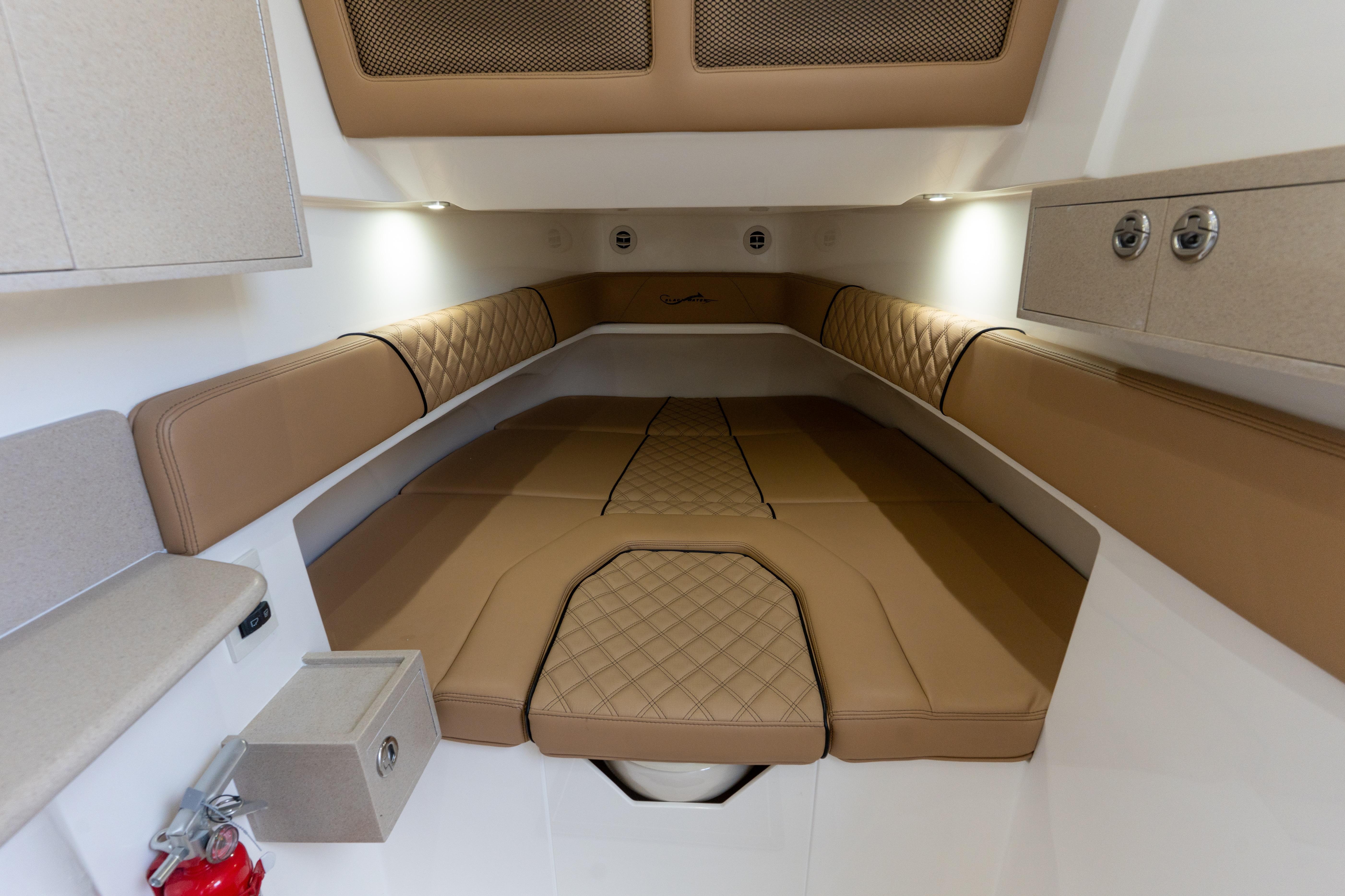 Luxurious cabin interior of 2026 Blackwater 41 Performance Fish boat with tan upholstery.