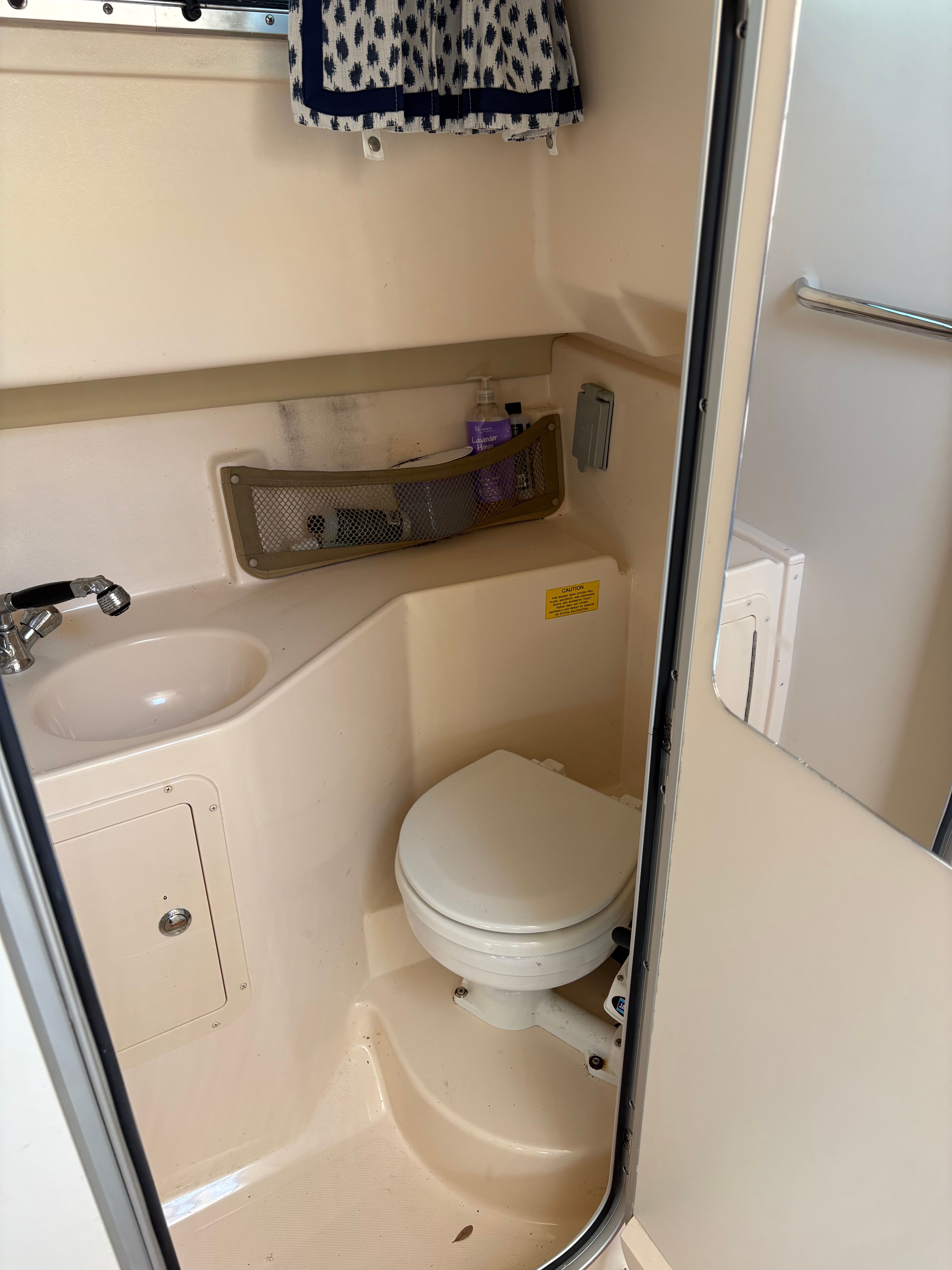 Interior of 2009 Grady-White Chesapeake 290 yacht, bathroom view.