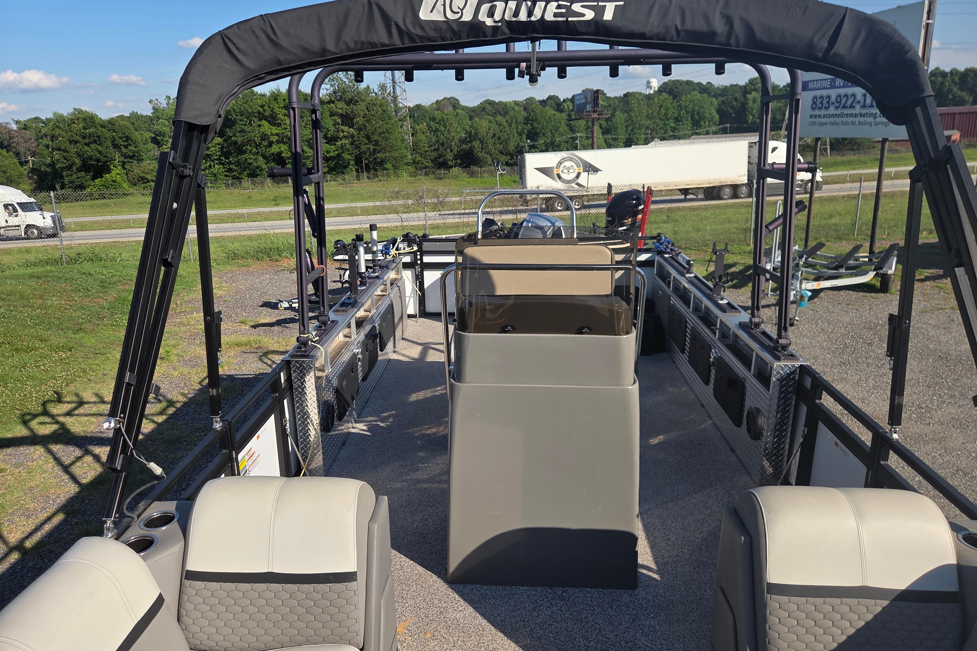 2024 Angler Qwest 8526 Pro Troll pontoon boat with spacious seating and fishing setup.