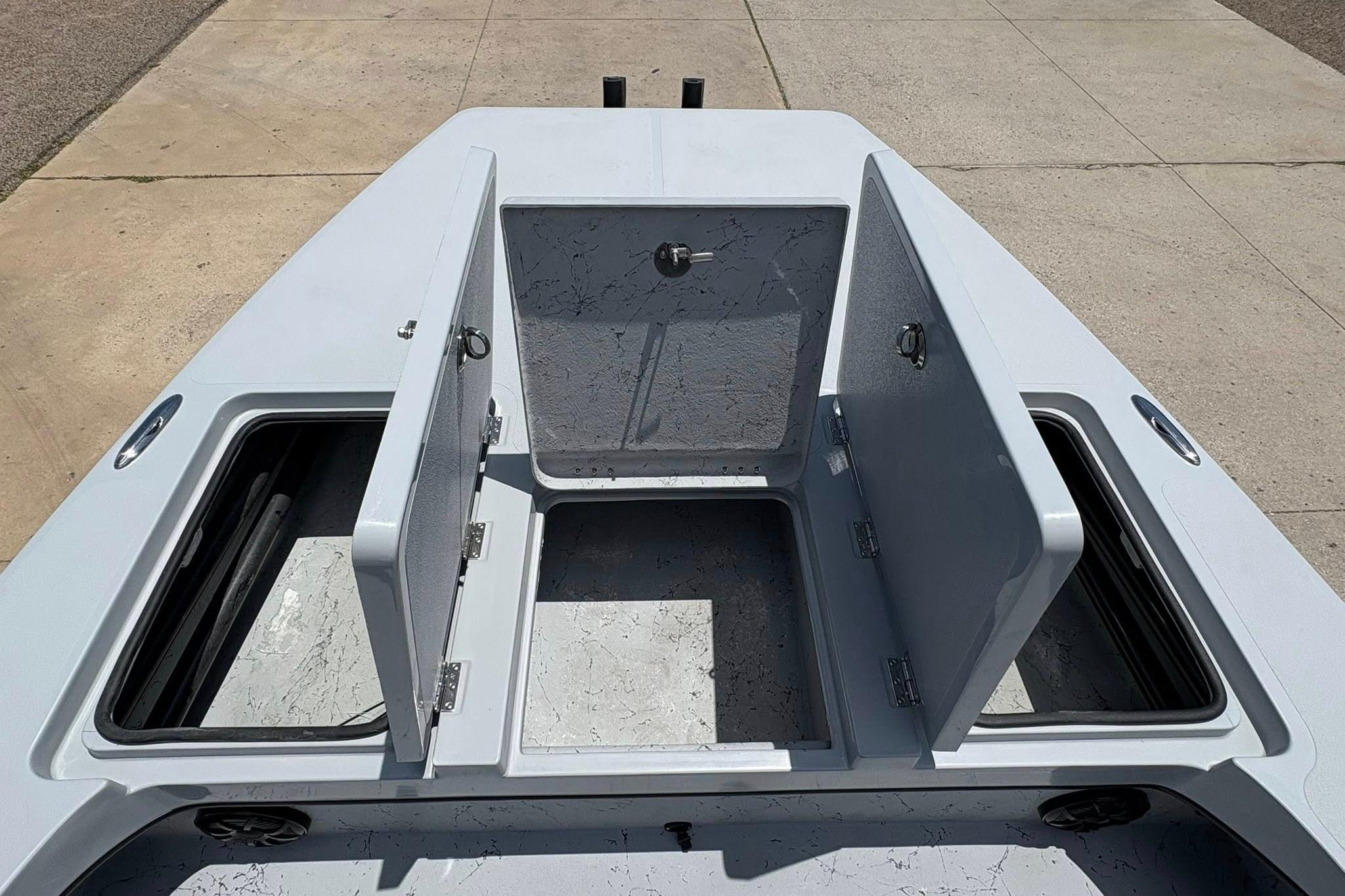 2026 Freedom Boats 23' Warrior with open storage compartments on deck.