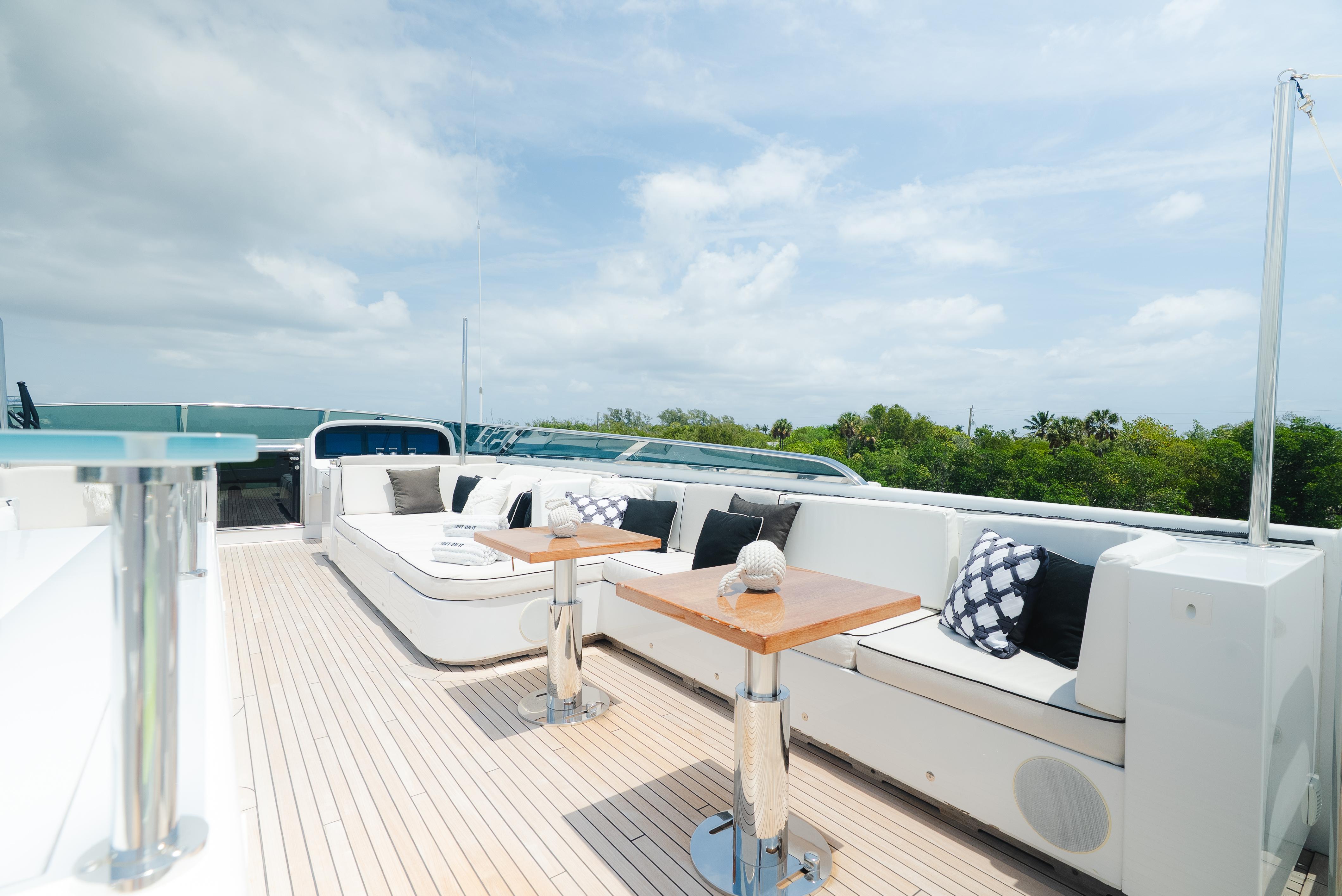 Luxurious deck of 2010 Arno Leopard 46 yacht with elegant seating and tables.
