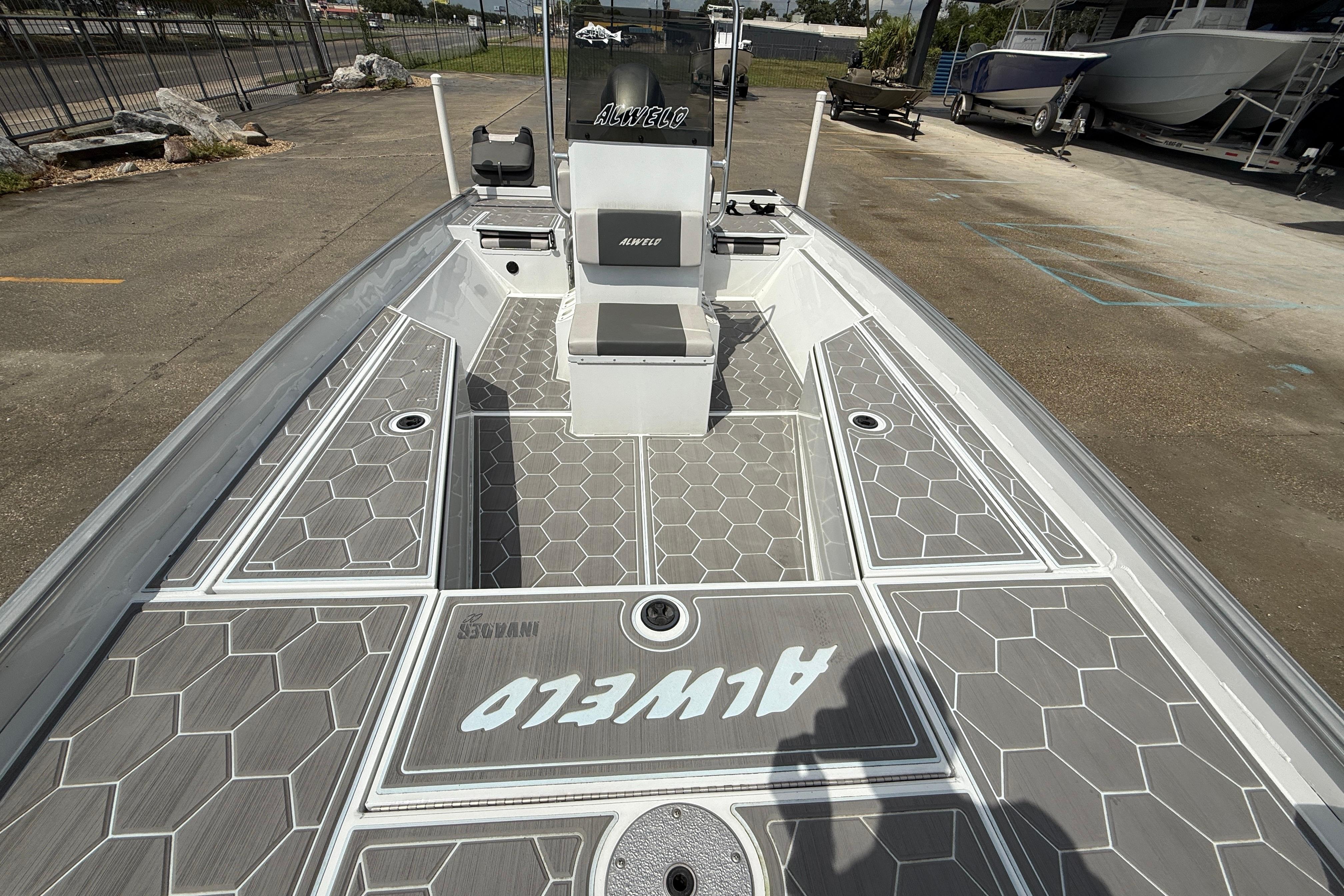 2024 Alweld 2070cc boat with hexagonal deck pattern and central console.