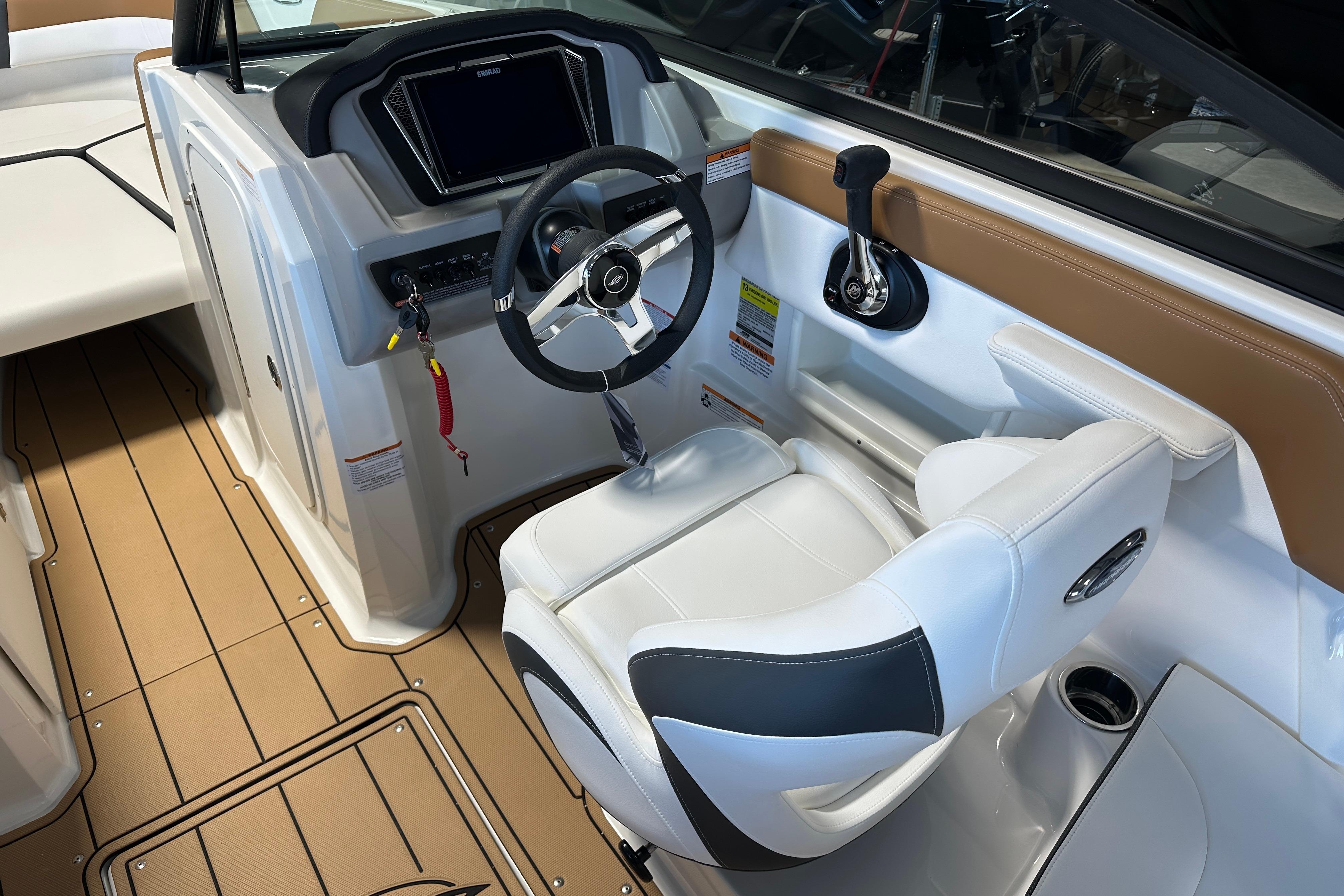 Interior of 2026 Chaparral 23 SSi with steering console and seat.