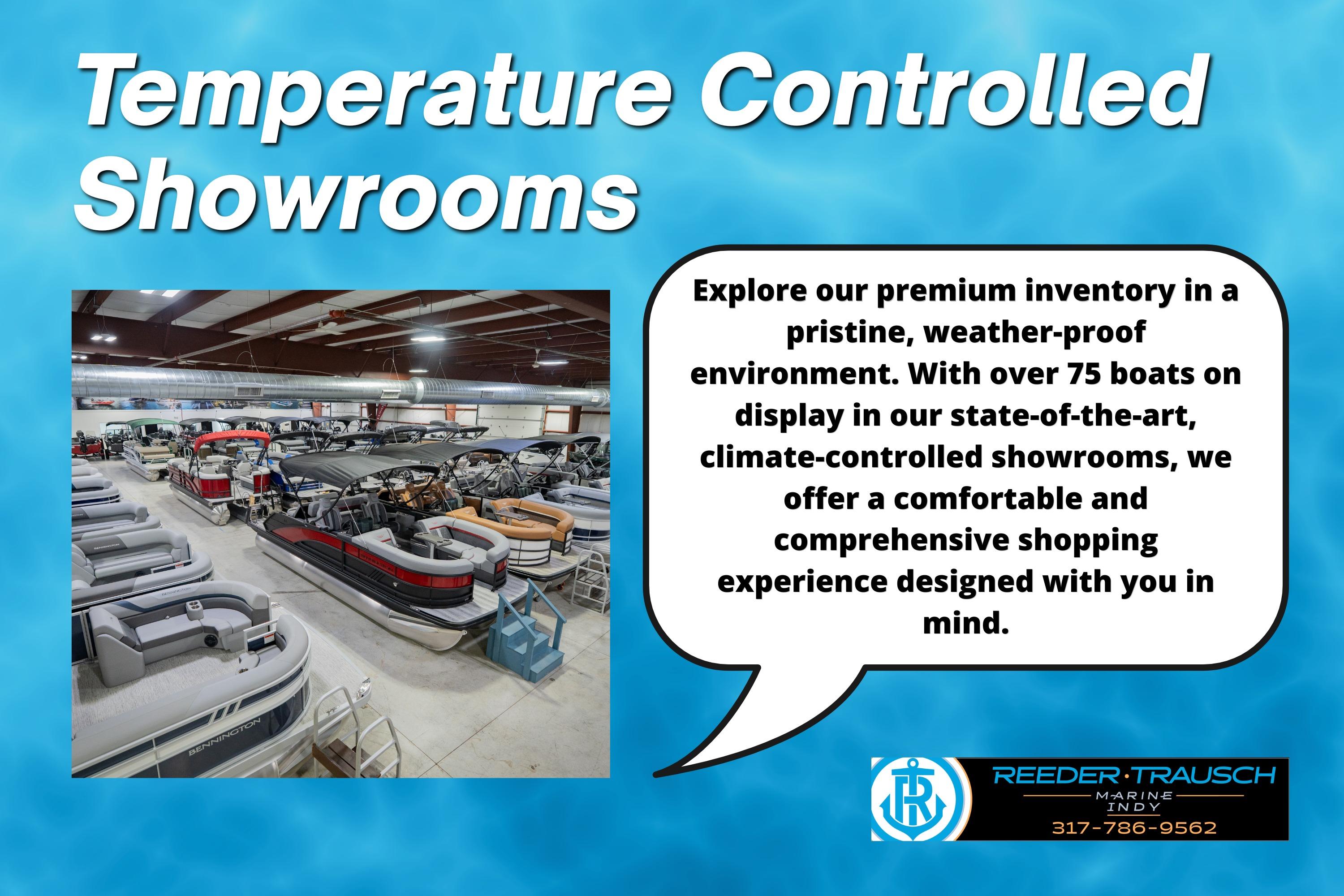 Temperature controlled showroom with boats, including 2026 Lund 1800 Explorer Sport, in pristine environment.