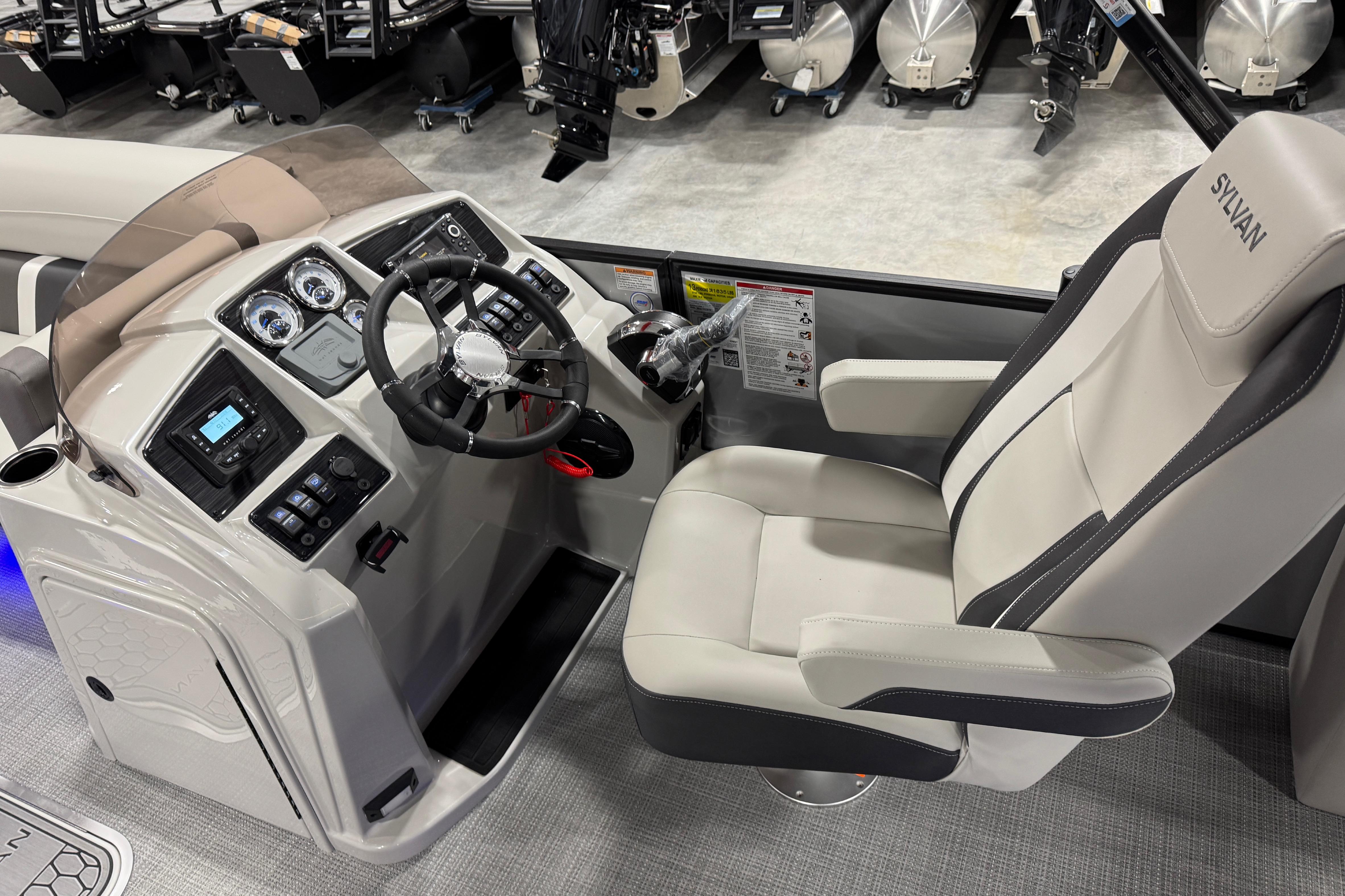 2026 Sylvan X5 boat cockpit with modern steering and control panel.