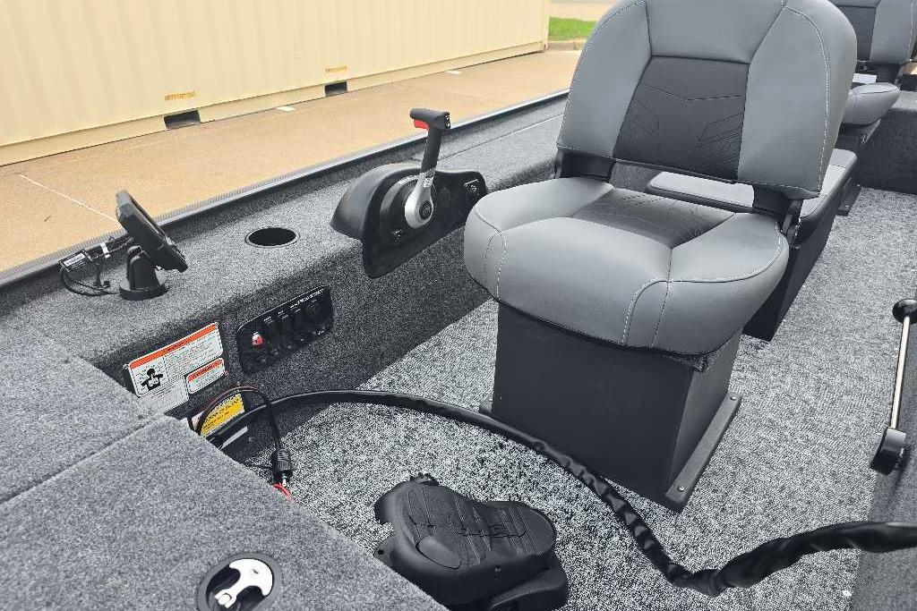 2026 Tracker Panfish 17 boat interior with gray seating and control panel.