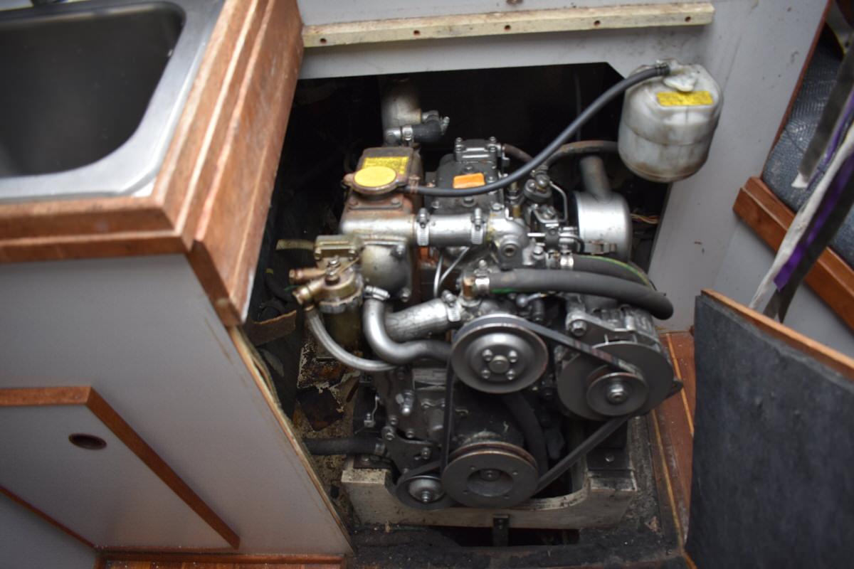 Engine compartment of a 1987 S2 9.2A yacht with visible engine.