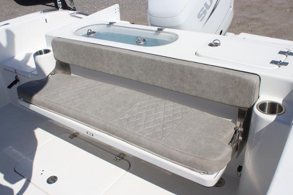 2023 Sea Pro 239 Center Console boat with cushioned seating and cup holders.