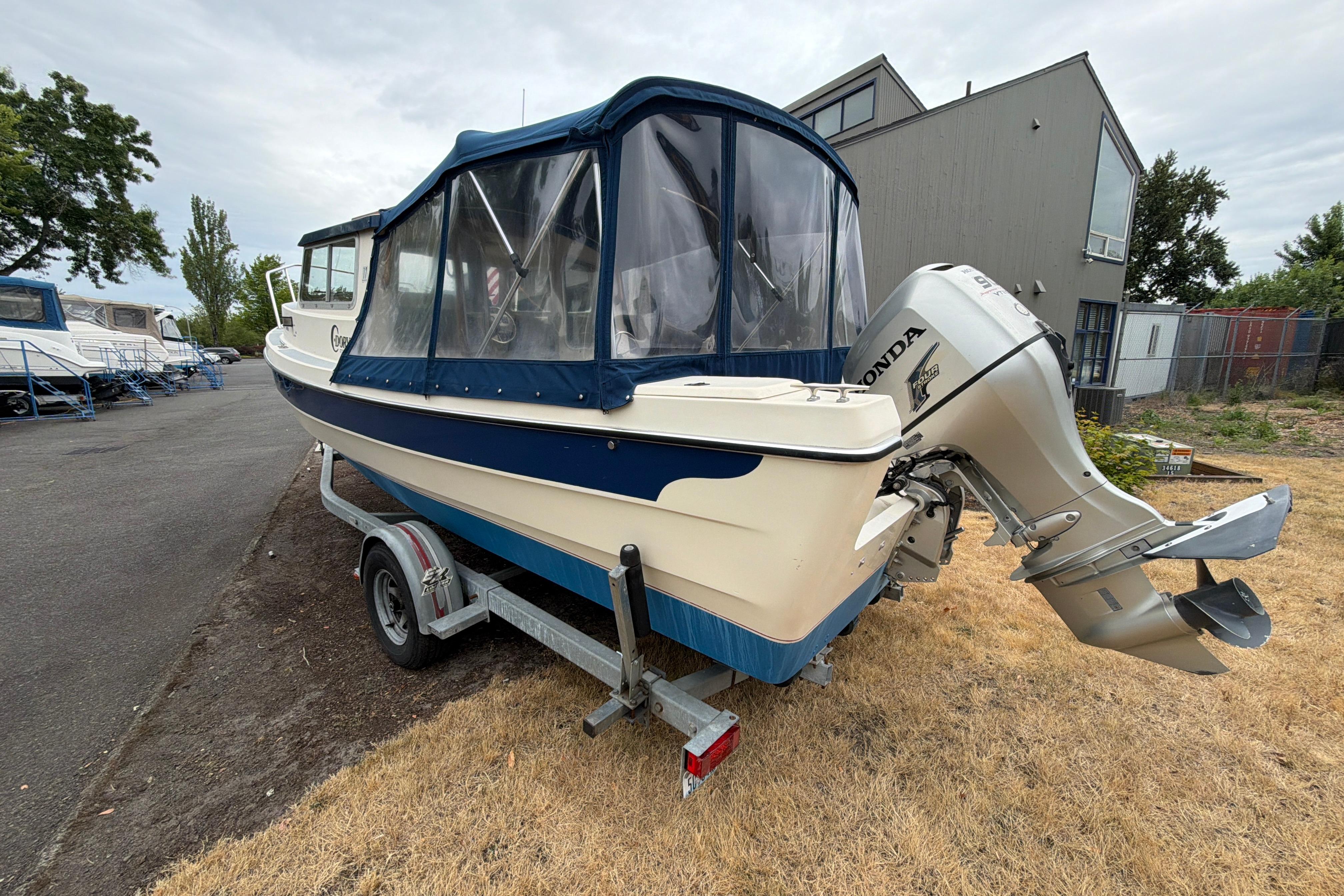 1989 C-Dory 22' Angler boat with Honda outboard motor on trailer.