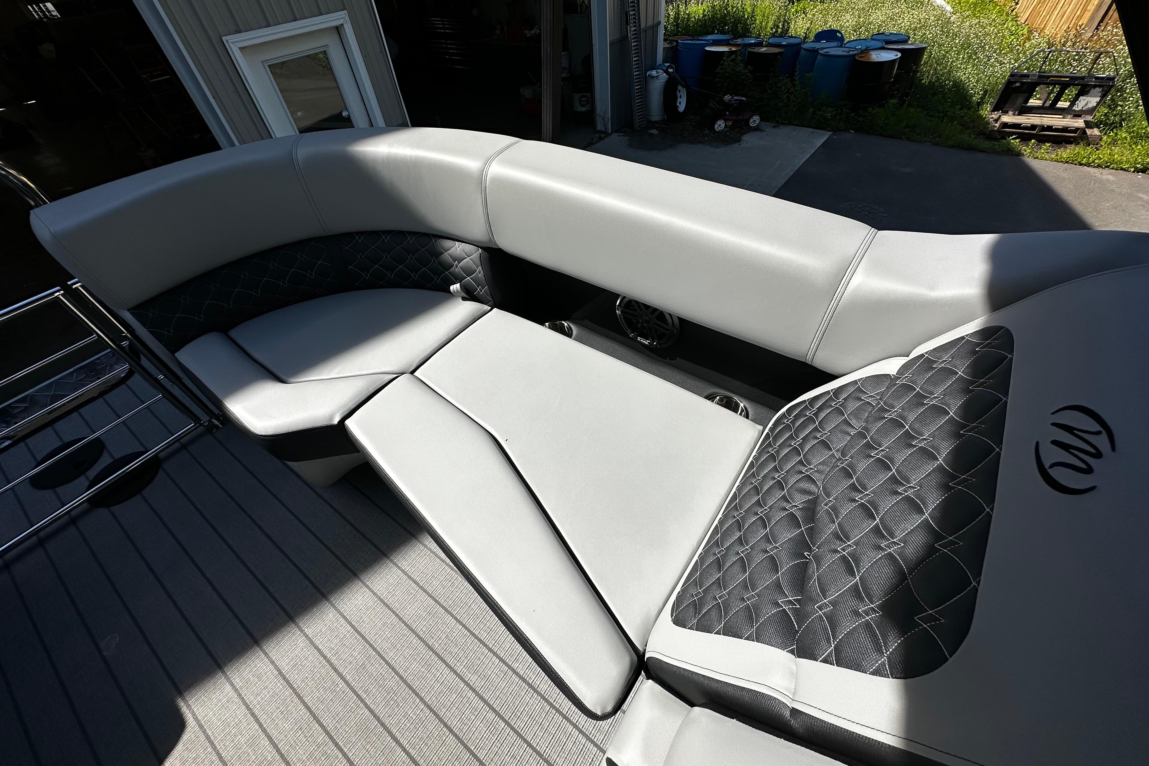 Luxurious seating on the 2027 Manitou 25 Encore RF pontoon boat, featuring elegant upholstery.