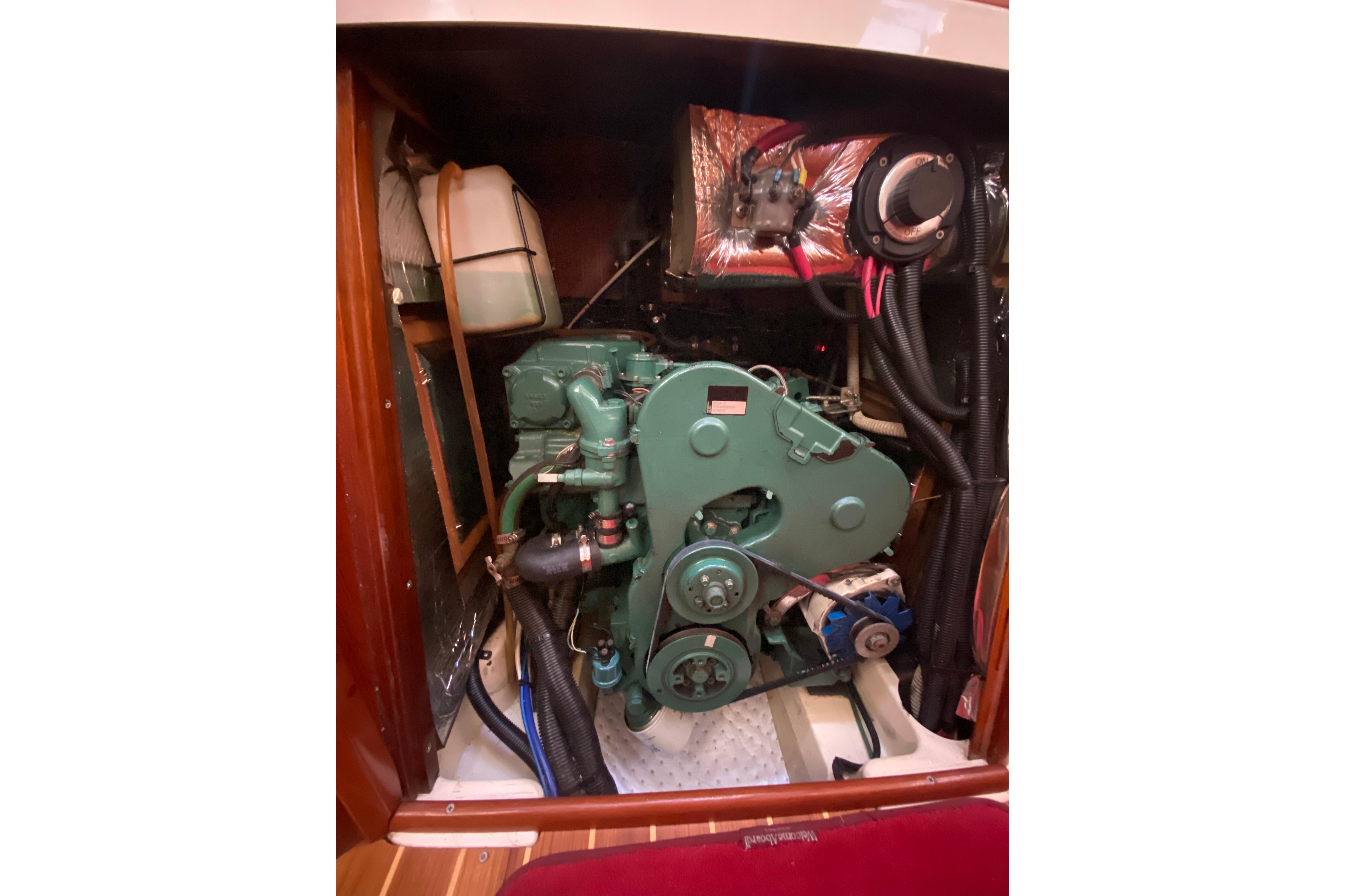 Engine compartment of a 1997 Hunter Legend 40.5 sailboat, showcasing mechanical components.