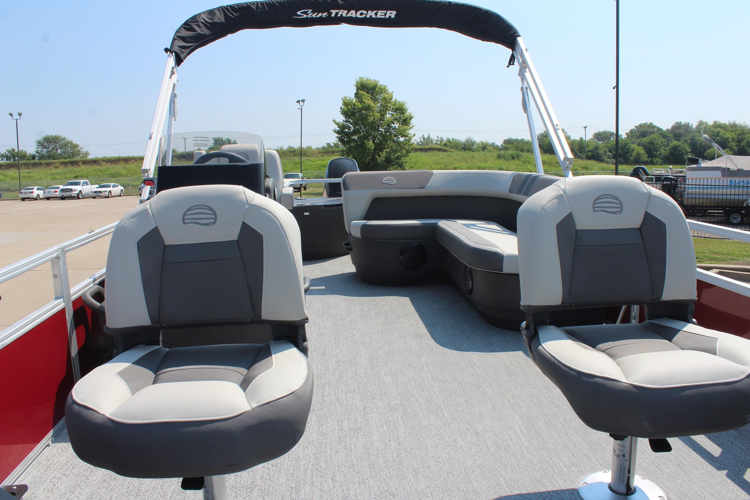 2026 Sun Tracker Bass Buggy 18 DLX pontoon boat interior with seating and canopy.