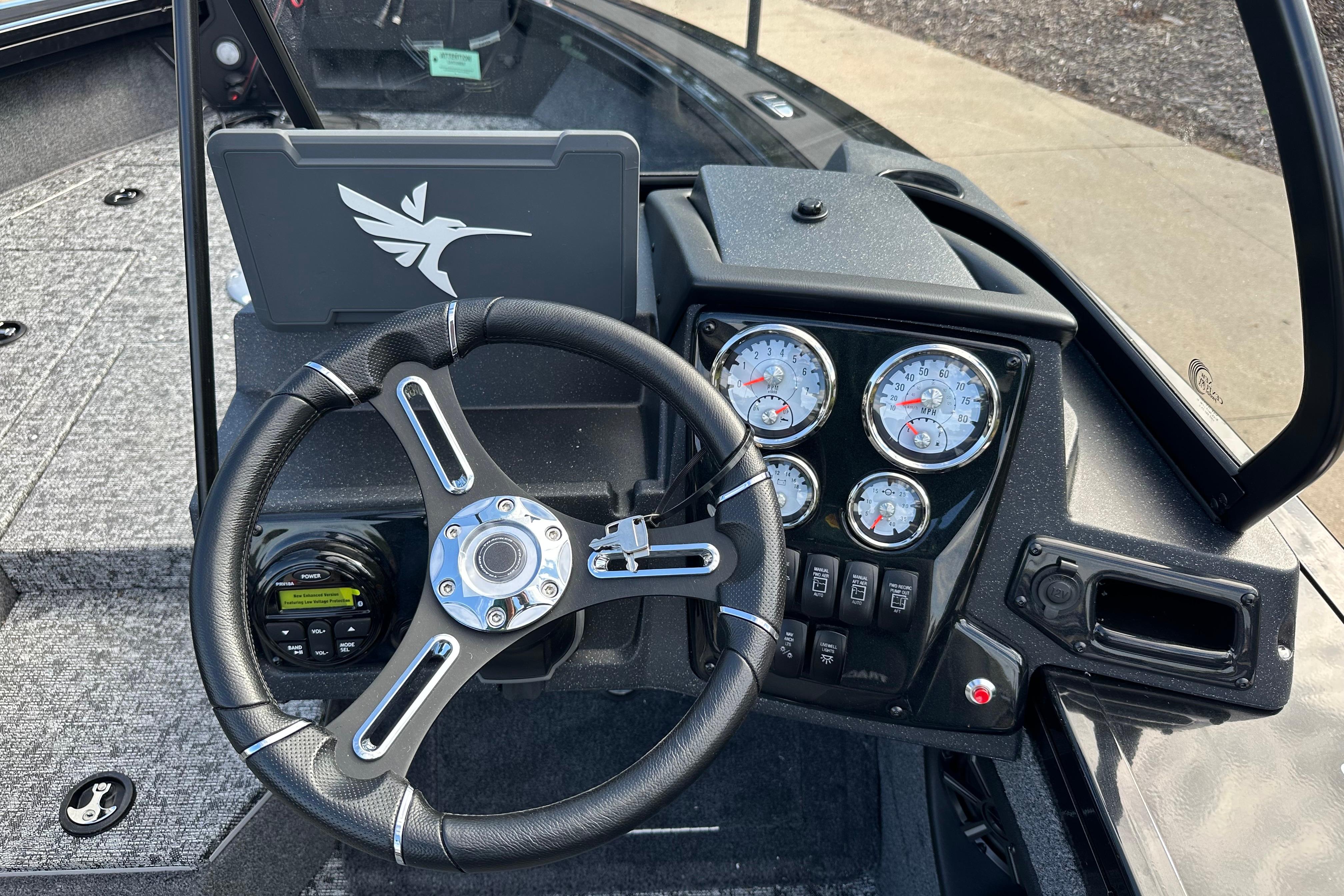 2026 Tracker Targa V-19 WT boat dashboard with steering wheel and gauges.