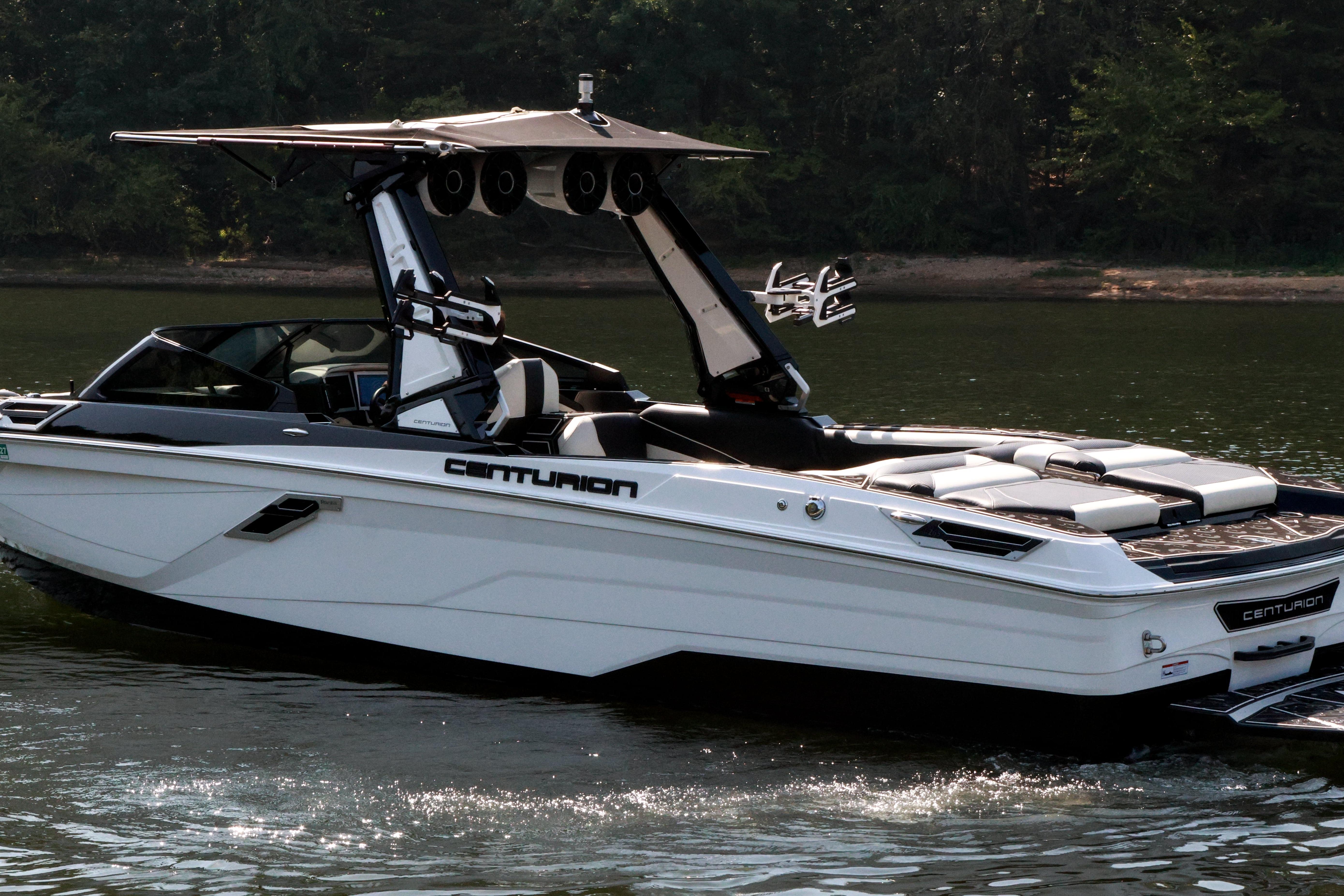 2022 Centurion Ri265 boat on calm water, featuring sleek design and modern amenities.