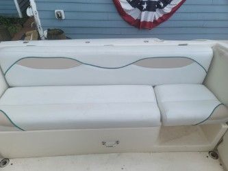 Interior of a 1996 Wellcraft 2400S with white seating.