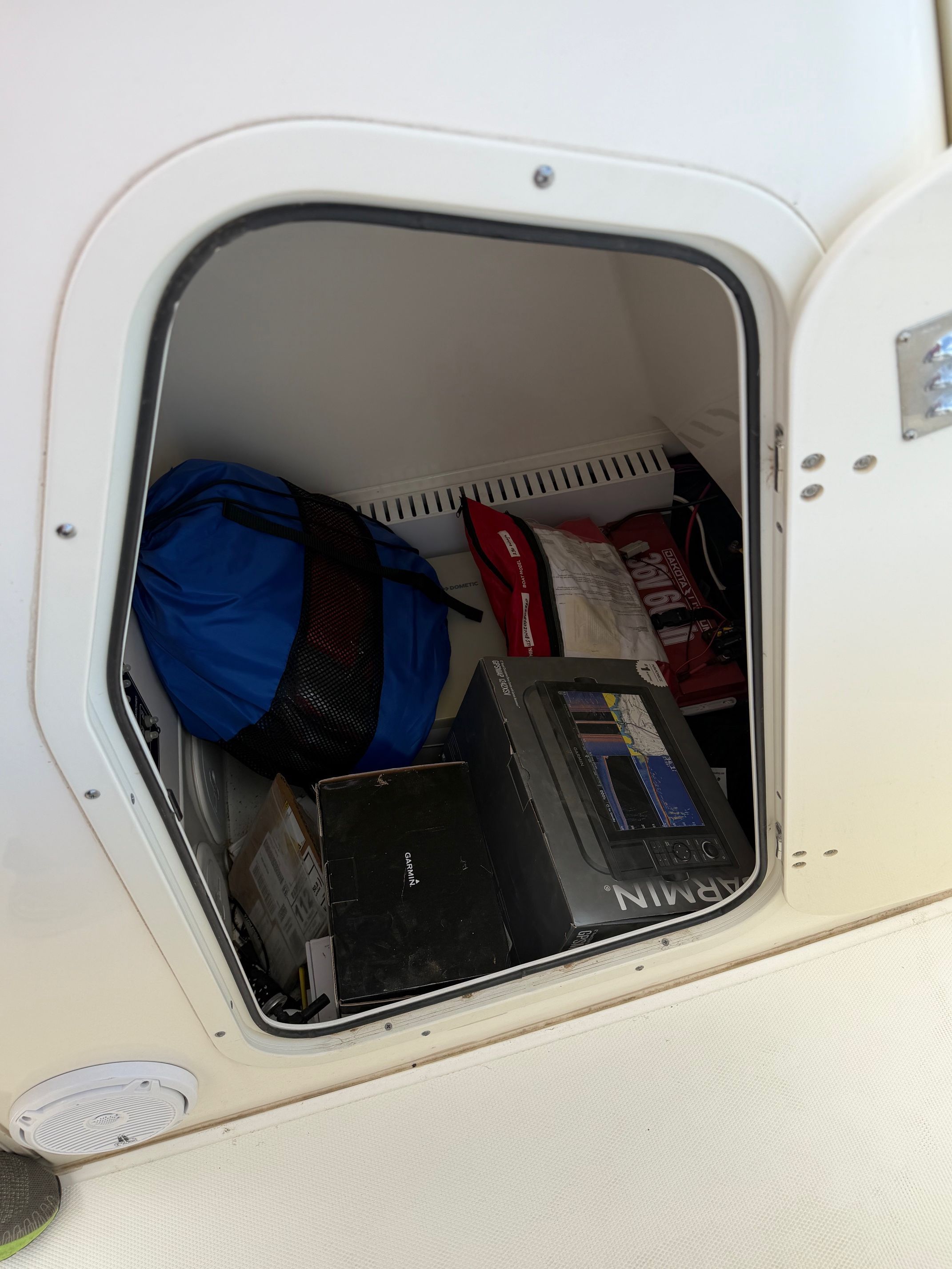 Storage compartment in Boston Whaler 230 Outrage boat, year 2020.