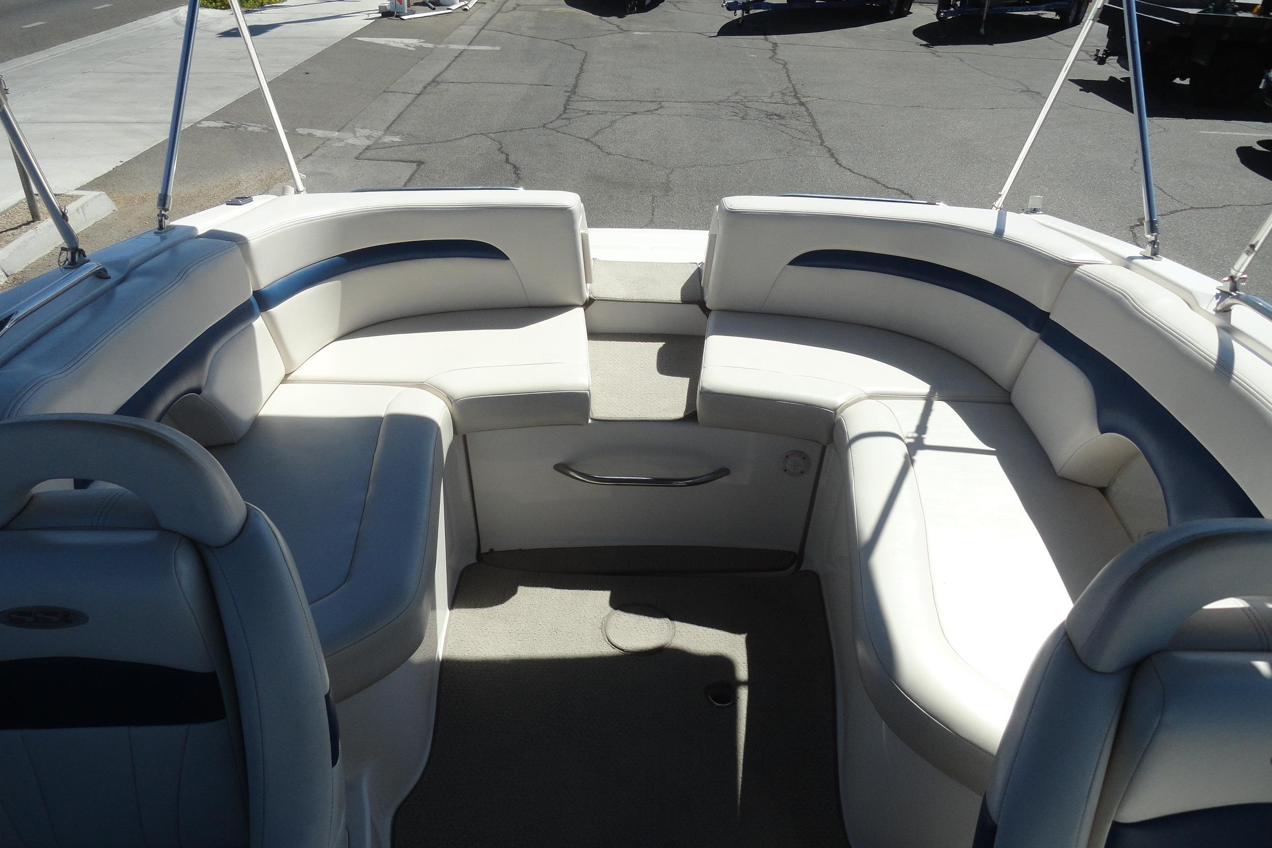 2001 Chaparral 265 SSi boat interior with white and blue seating arrangement.