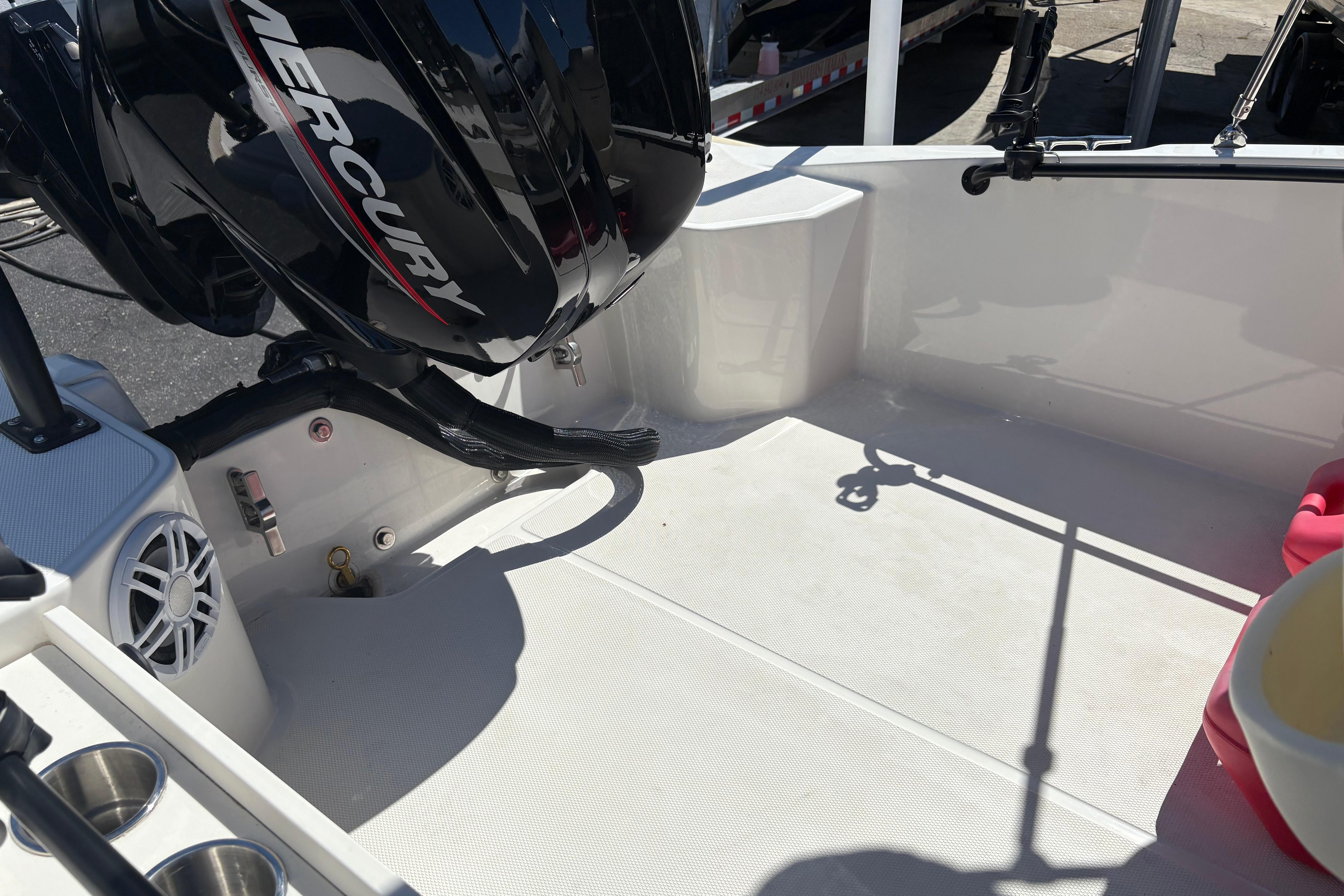 2024 Boston Whaler 160 Super Sport boat interior with Mercury engine, showcasing spacious deck area.
