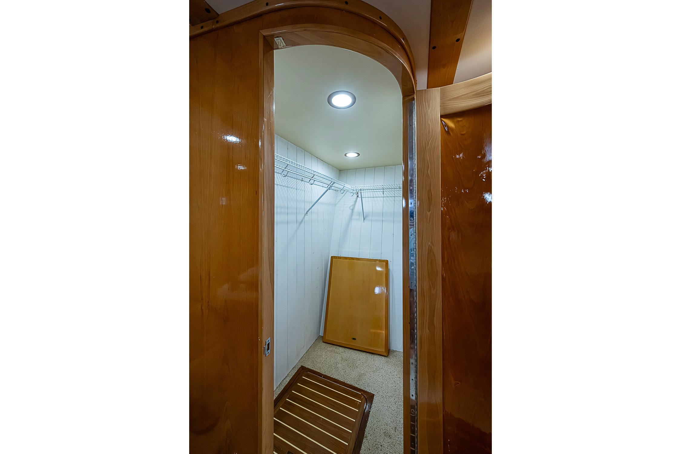 Spacious wooden interior of 2003 Magna Marine Nova Scotia 47 yacht closet.