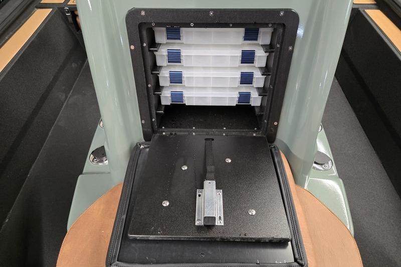Storage compartment of 2026 Avid 207 Recon boat with organized trays.