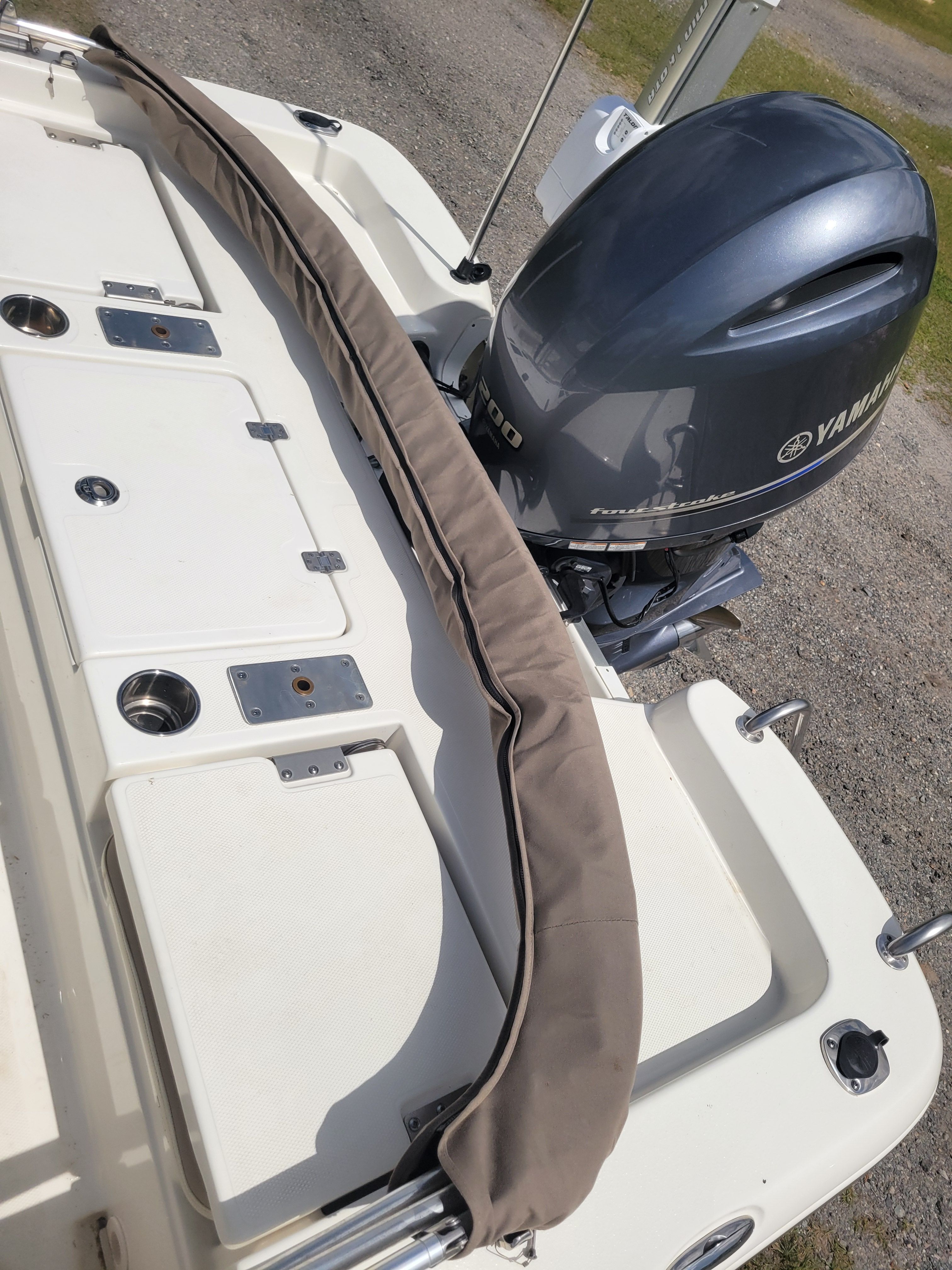 A boat with a Yamaha engine on a trailer, ready for use.