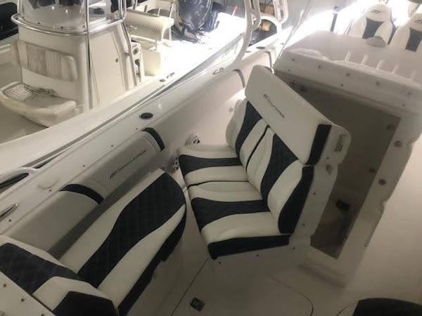 2019 Midnight Express 39 Cuddy boat interior with cushioned seating and sleek design.