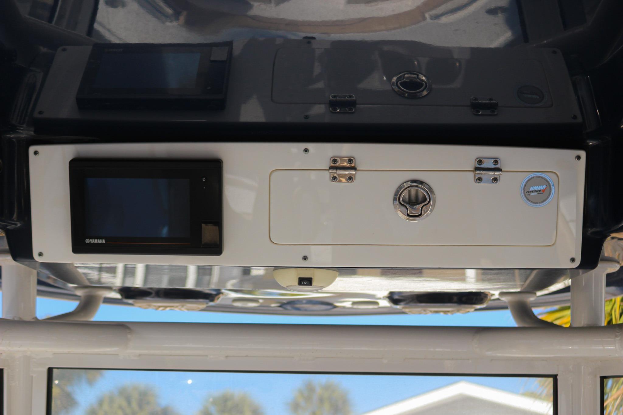 2020 Sportsman Masters 267OE Bay Boat console with Yamaha display and storage compartment.