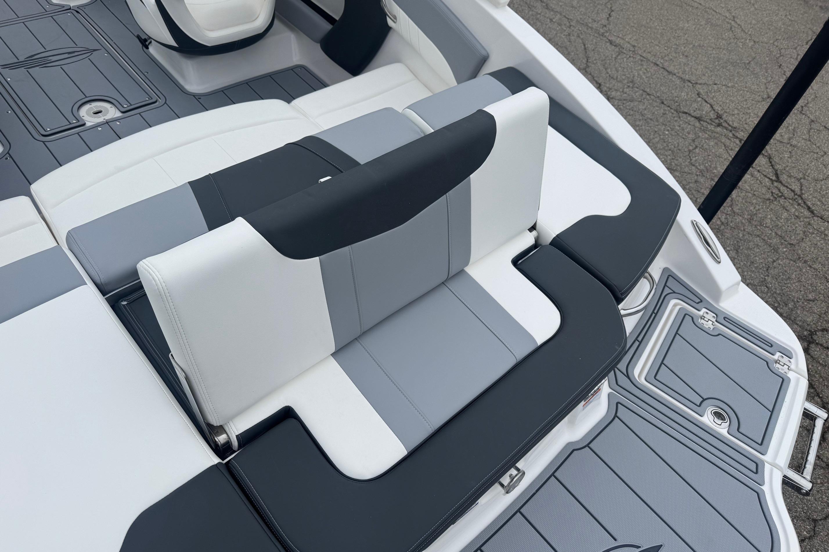 2026 Chaparral 21 SSi boat interior with sleek, modern seating design in gray and white.