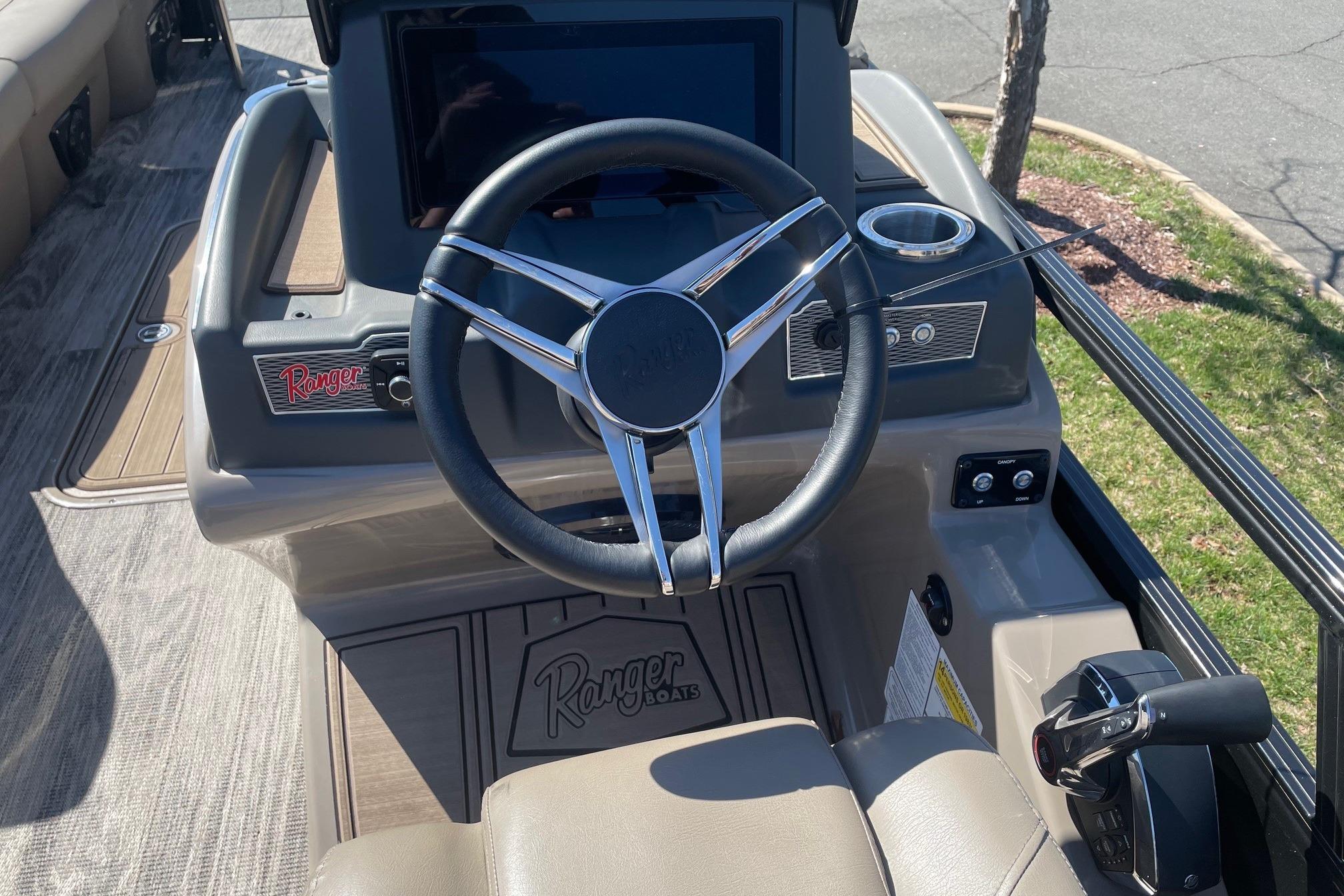 2024 Ranger 2500LS boat dashboard with steering wheel and control panel.