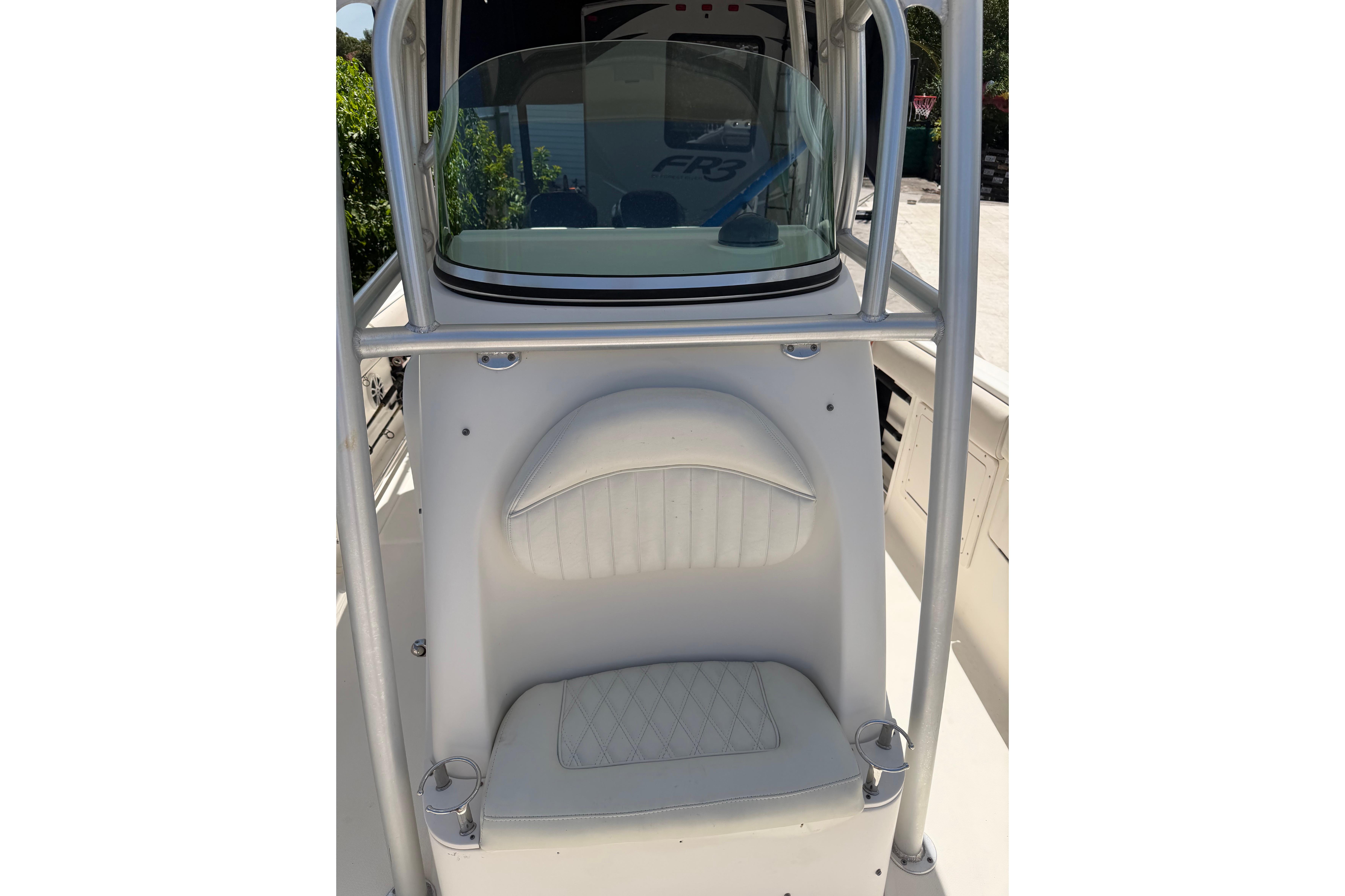 2007 Robalo R260 Center Console boat interior with cushioned seating and windshield.