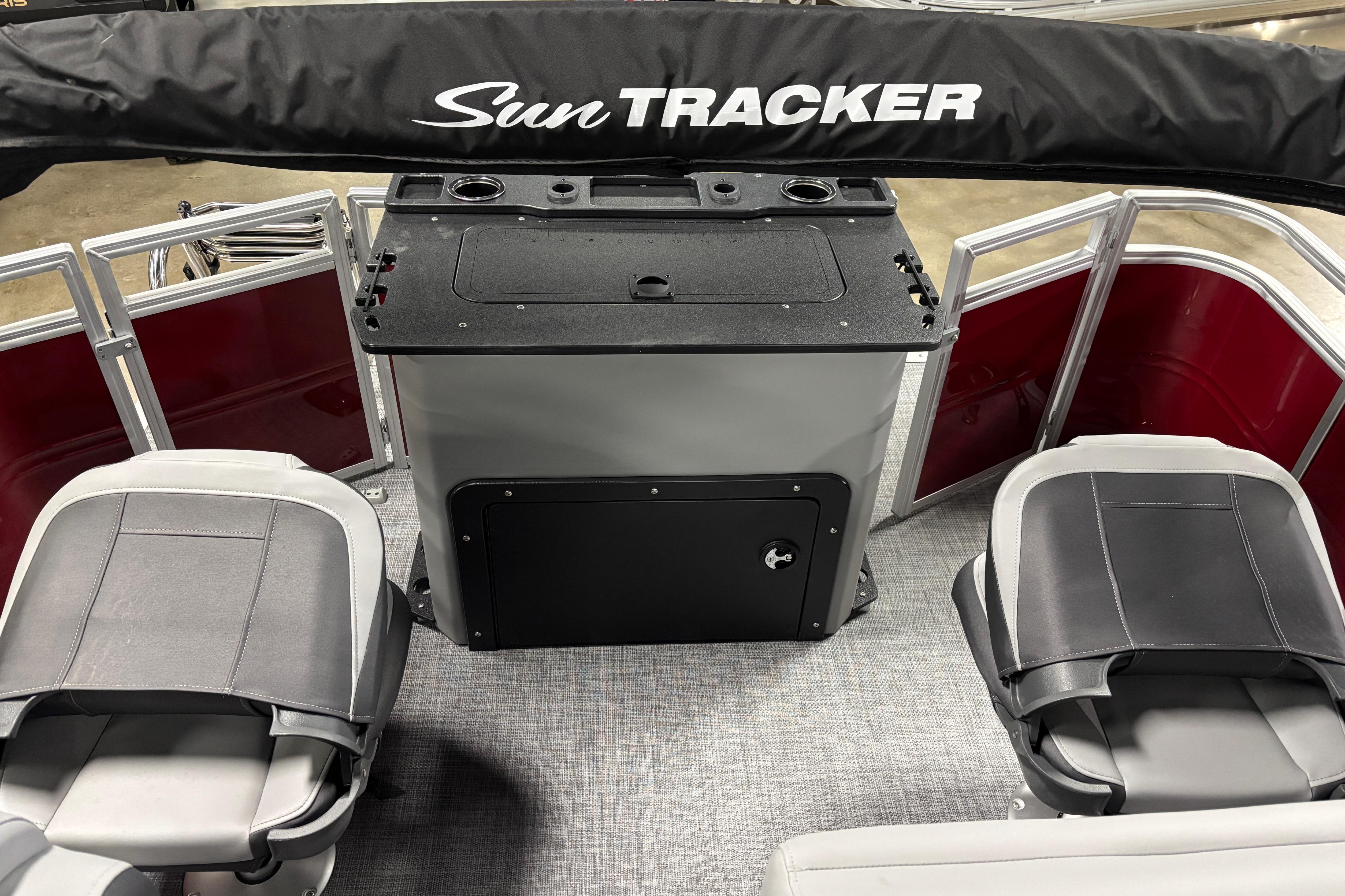 2026 Sun Tracker SportFish 20 DLX interior with seating and storage area.
