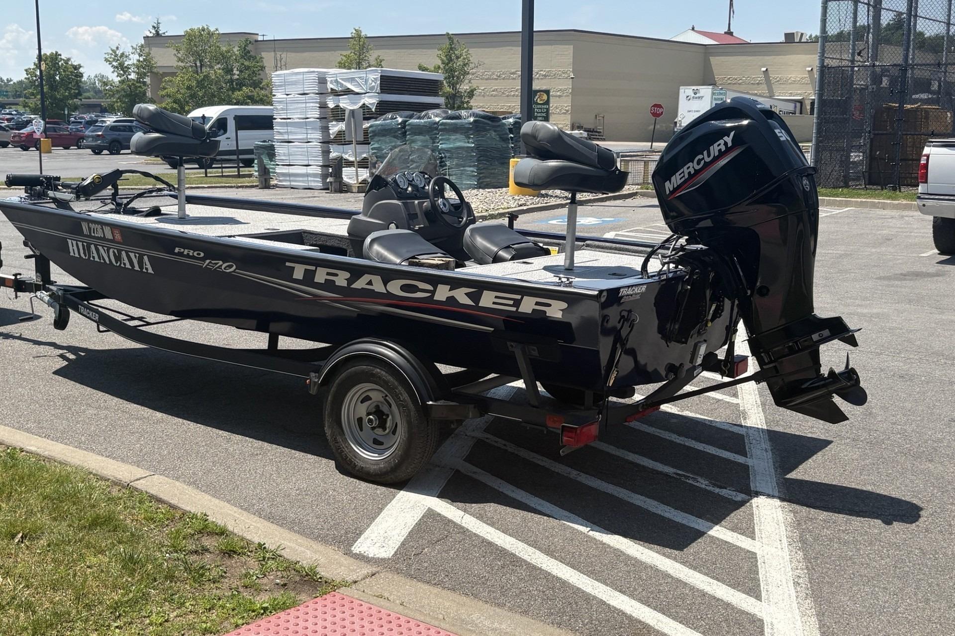 2020 Tracker Pro 170 boat with Mercury engine parked in a lot.