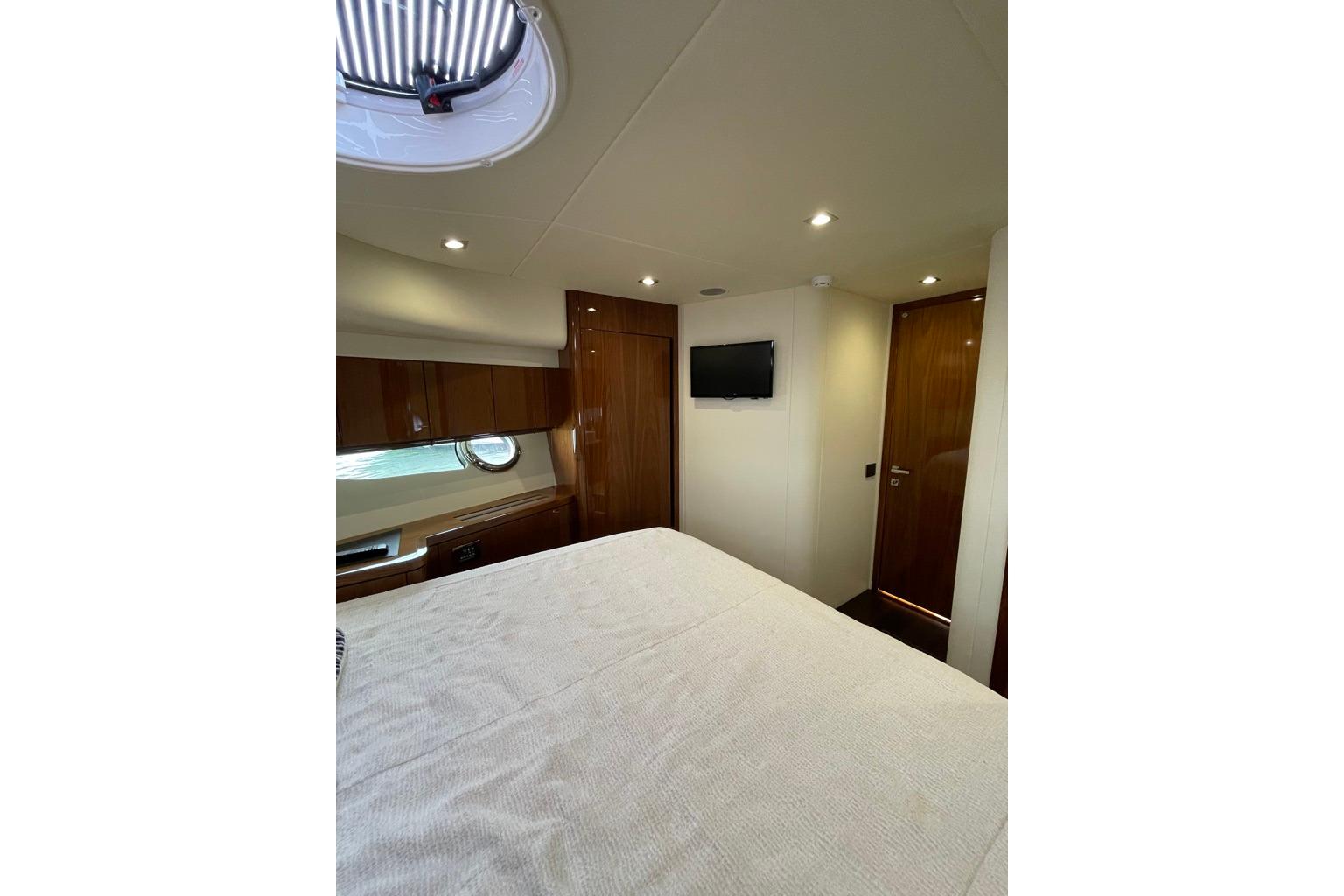 Luxurious cabin interior of 2016 Sunseeker Manhattan 65 yacht with modern amenities.