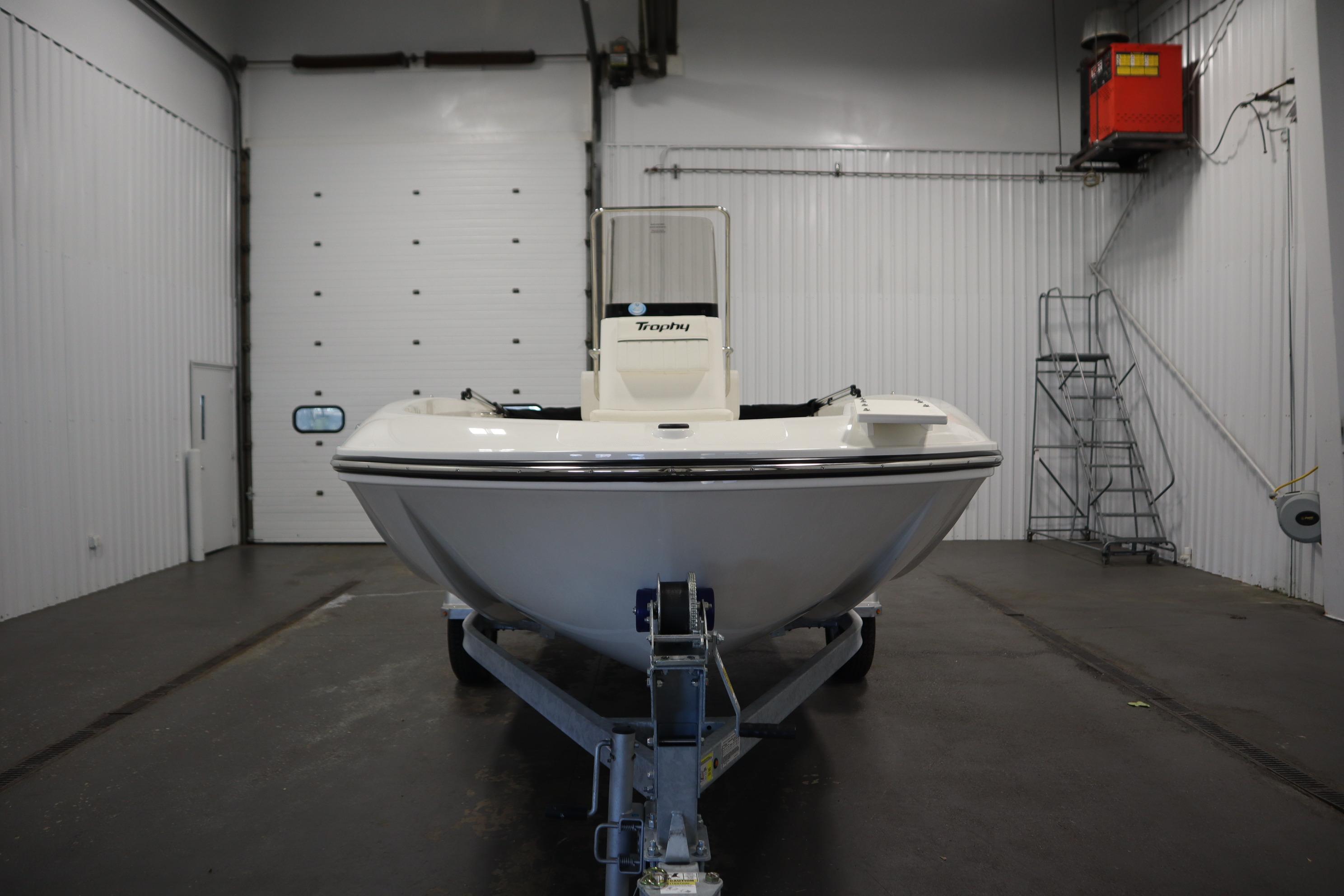 2026 Bayliner Trophy T18 boat on trailer in indoor storage facility.