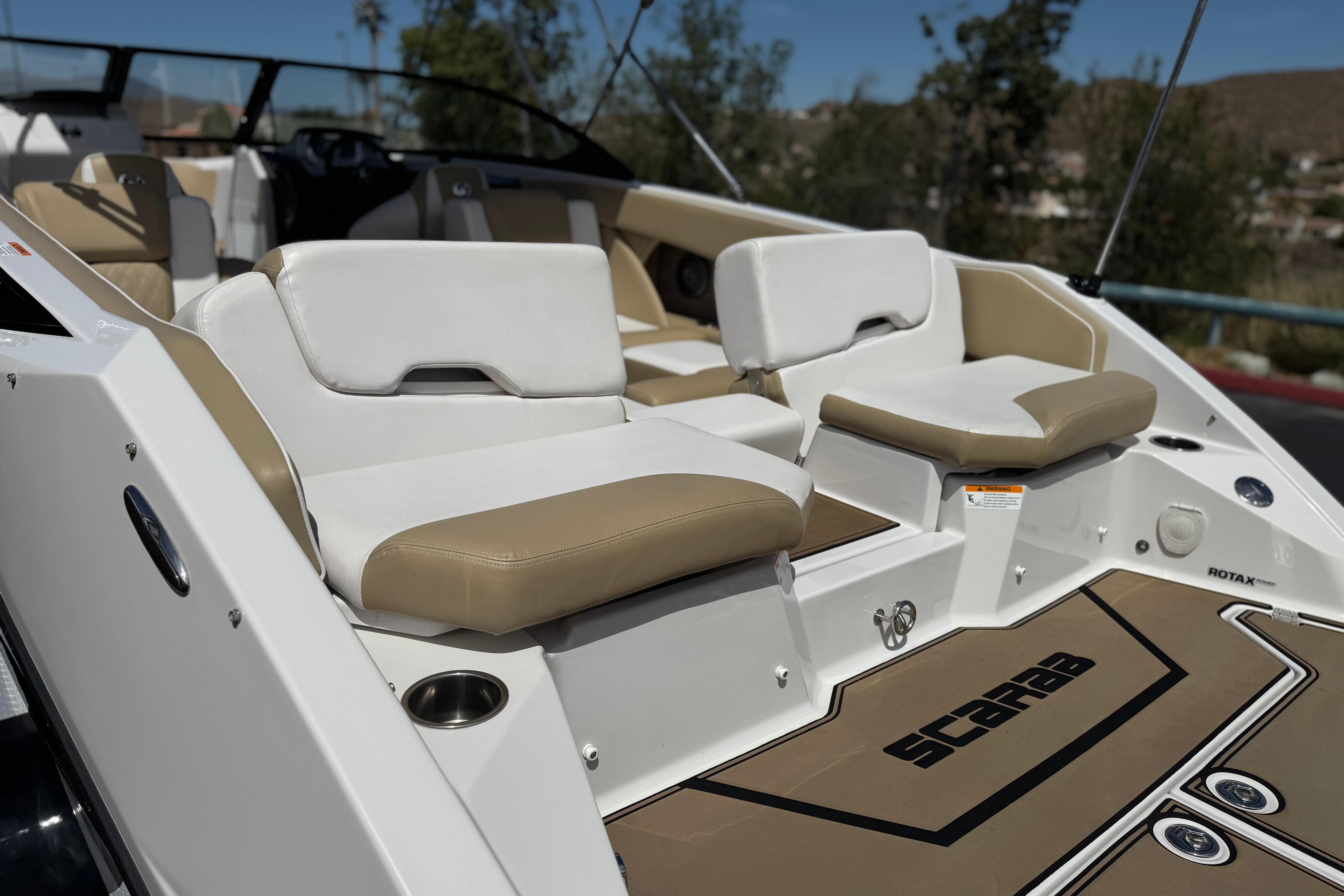 2017 Scarab 255 H.O. Platinum boat interior with beige and white seating.