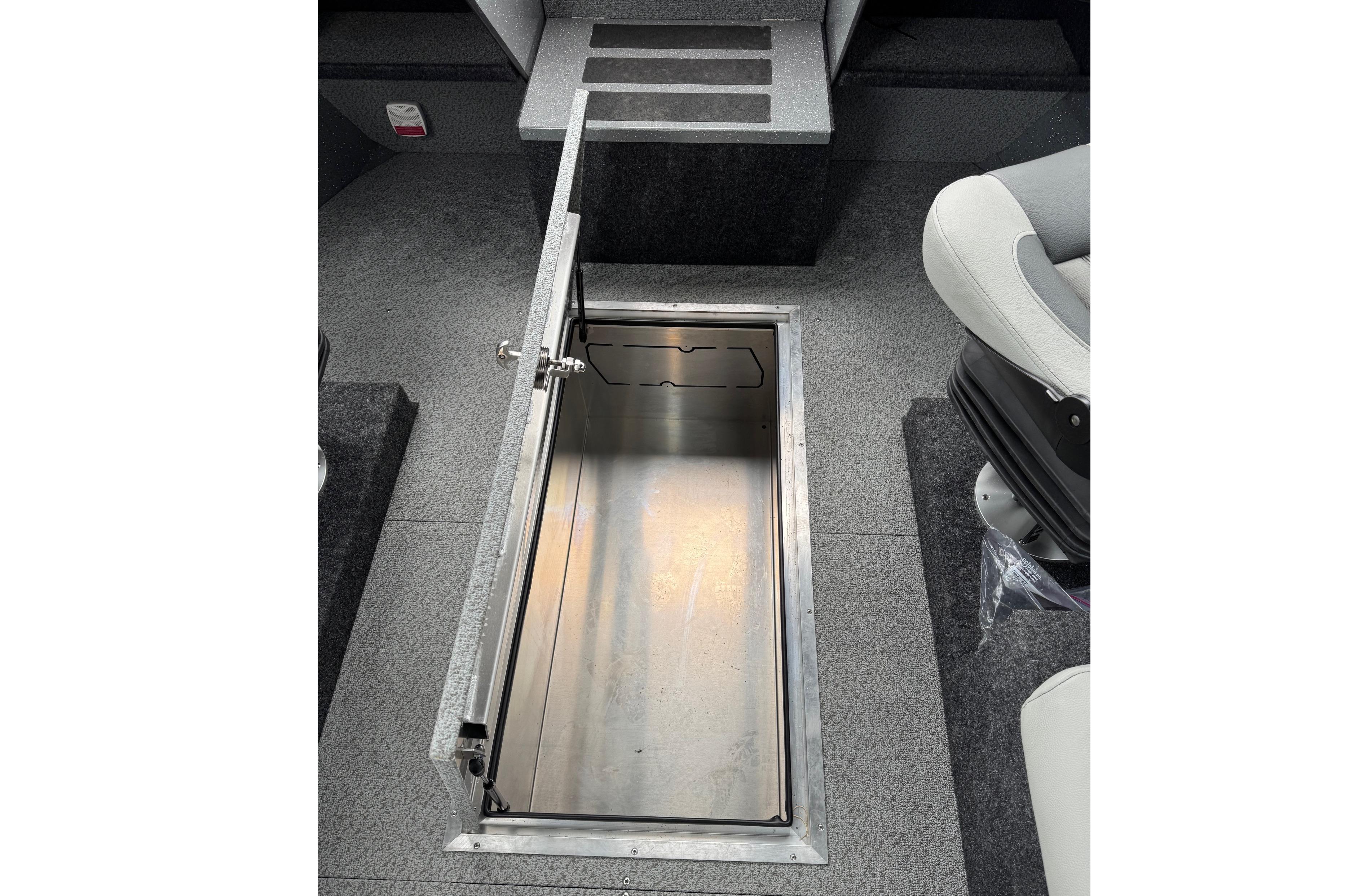 Open storage compartment in 2024 Spartan 24 MAXIMUS PRO XL boat interior.