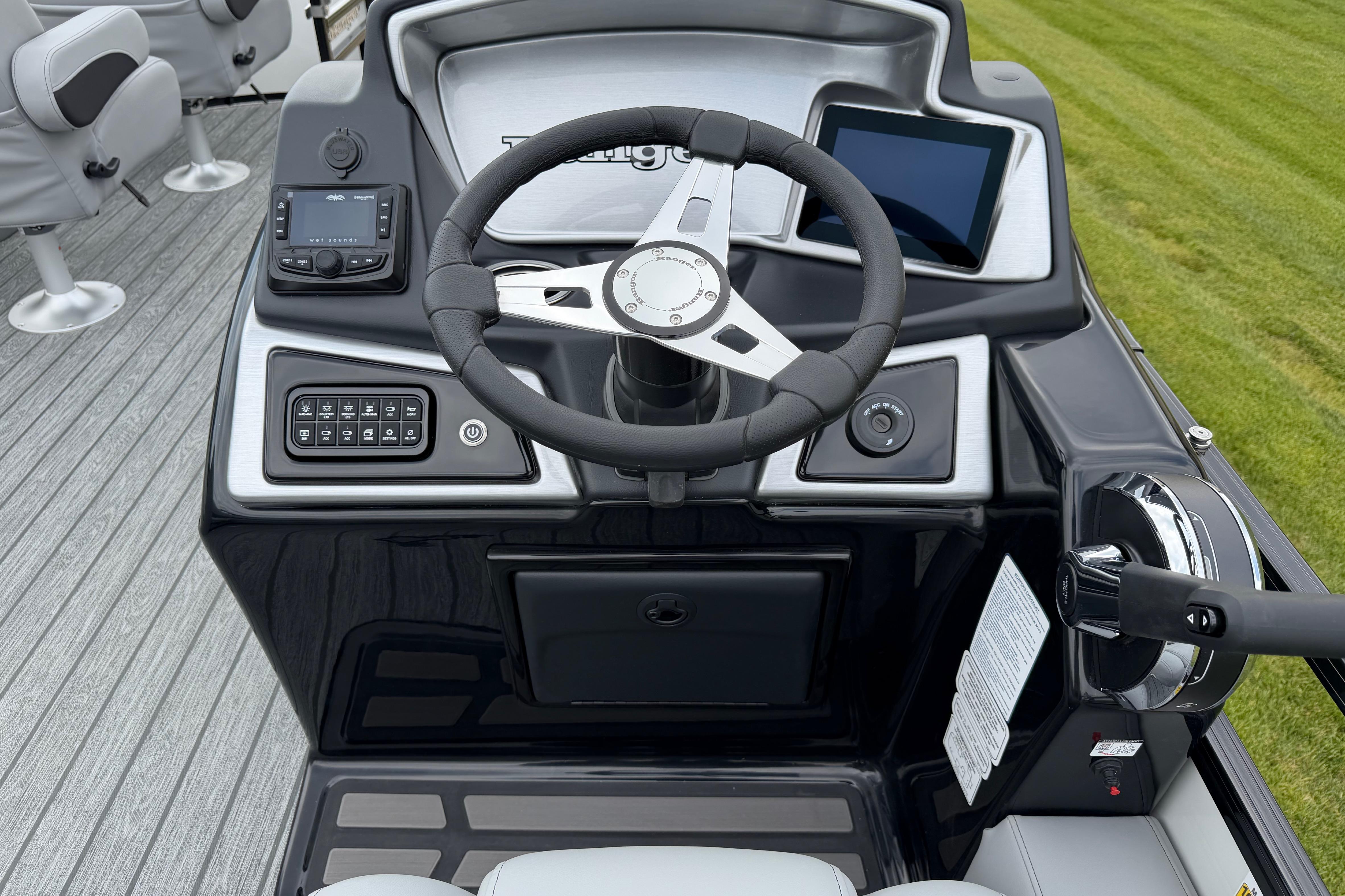 Steering console of 2026 Ranger 220FC boat with modern controls and digital displays.