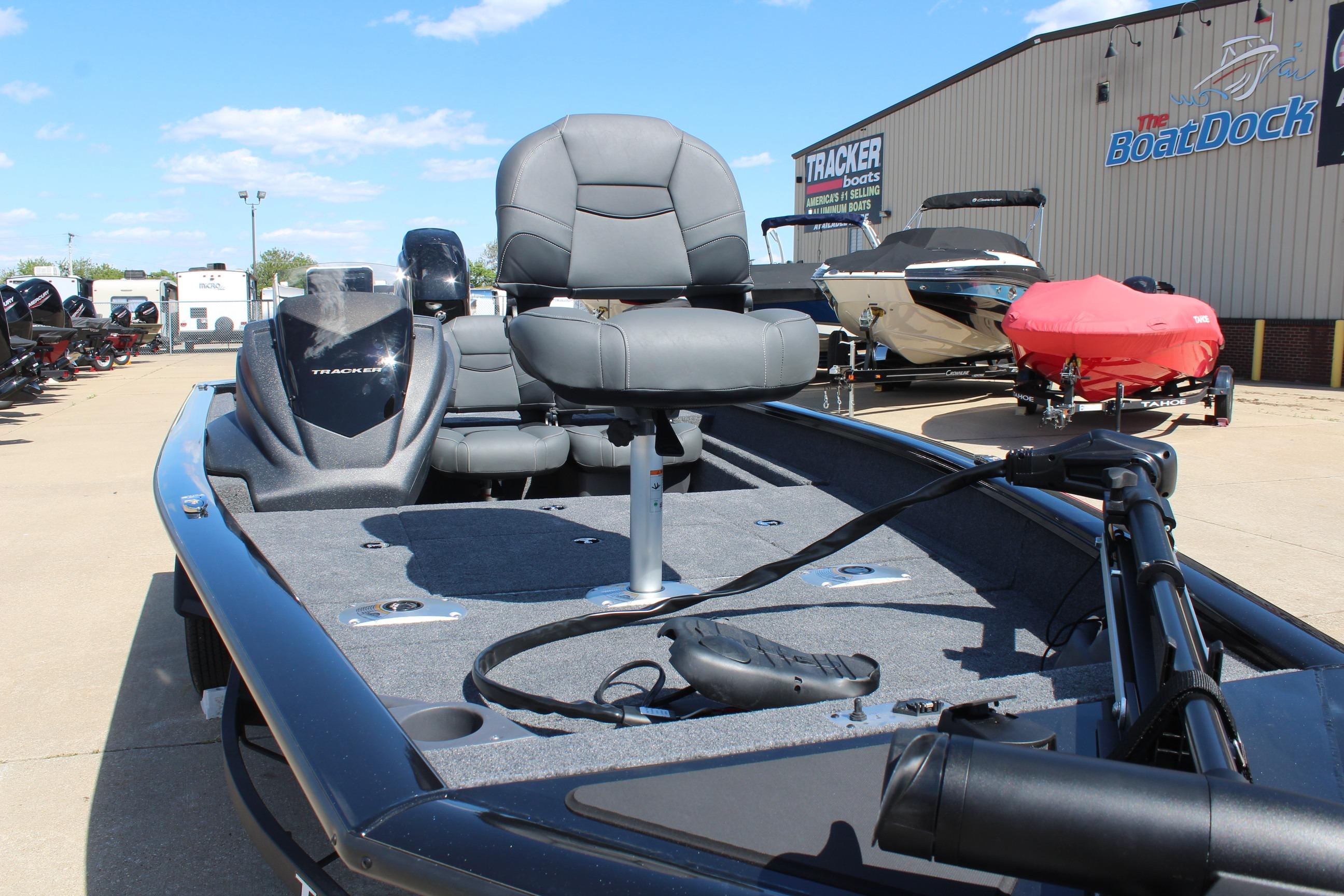 2026 Tracker Pro Team 175 Crappie Edition boat at dealership, featuring comfortable seating.