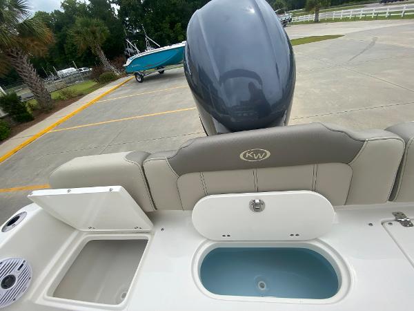 2024 Key West 189 FS boat rear view with motor and seating.
