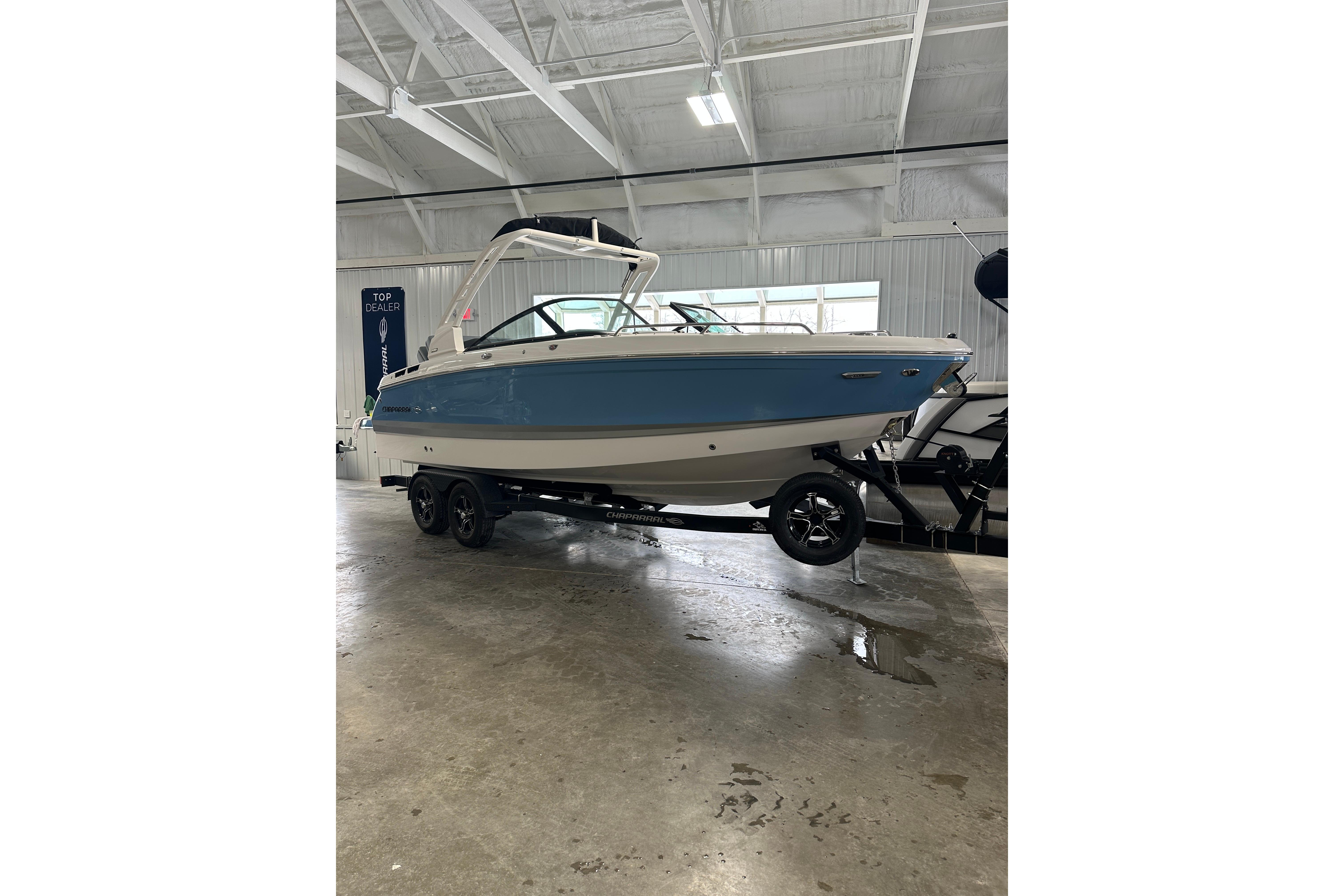 2026 Chaparral SSX 6 boat in a showroom.